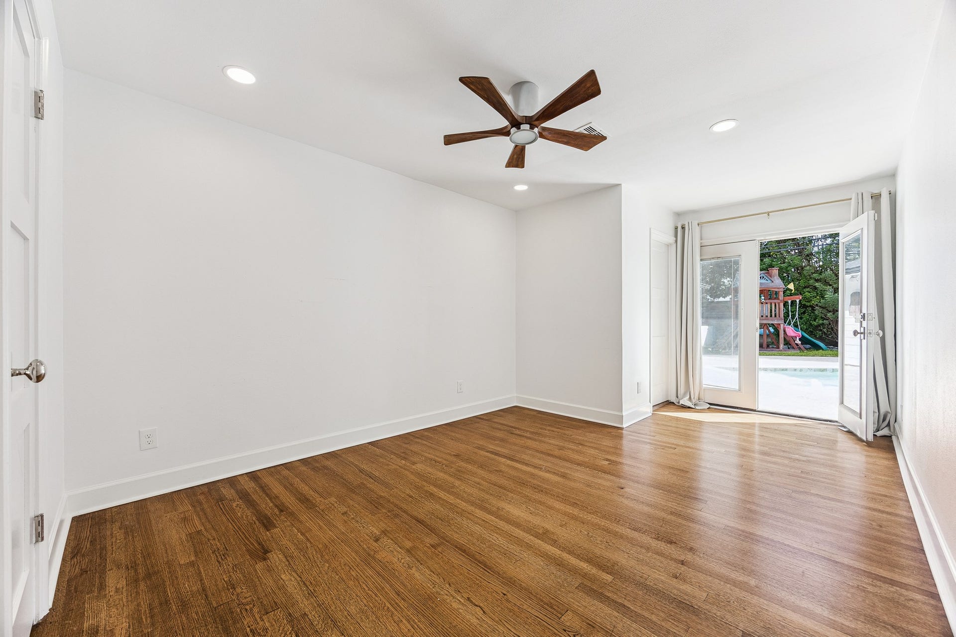 2503 Stoney Brook Drive, Houston, TX 77063 (17x12) French doors invite natural light into this bedroom while allowing you direct access to the pool. The space strikes a refined balance between comfort and sophistication.