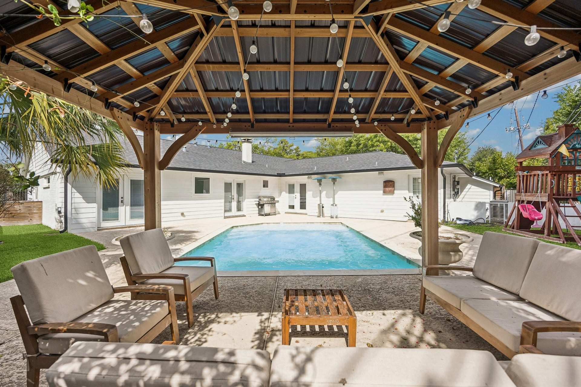 2503 Stoney Brook Drive, Houston, TX 77063 Relax in the shade of the beautiful covered pavilion while enjoying views of the pool and backyard. This exceptional outdoor living space offers the perfect setting for gatherings, weekend lounging, or quiet evenings at home.