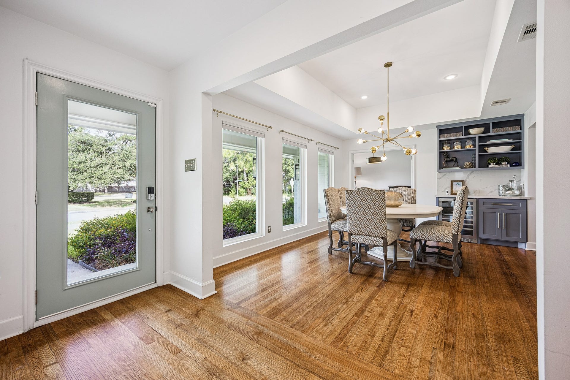 2503 Stoney Brook Drive, Houston, TX 77063 Step inside to discover beautiful hardwood floors, abundant natural light, and an inviting dining area. Large windows overlook the beautifully landscaped front yard.