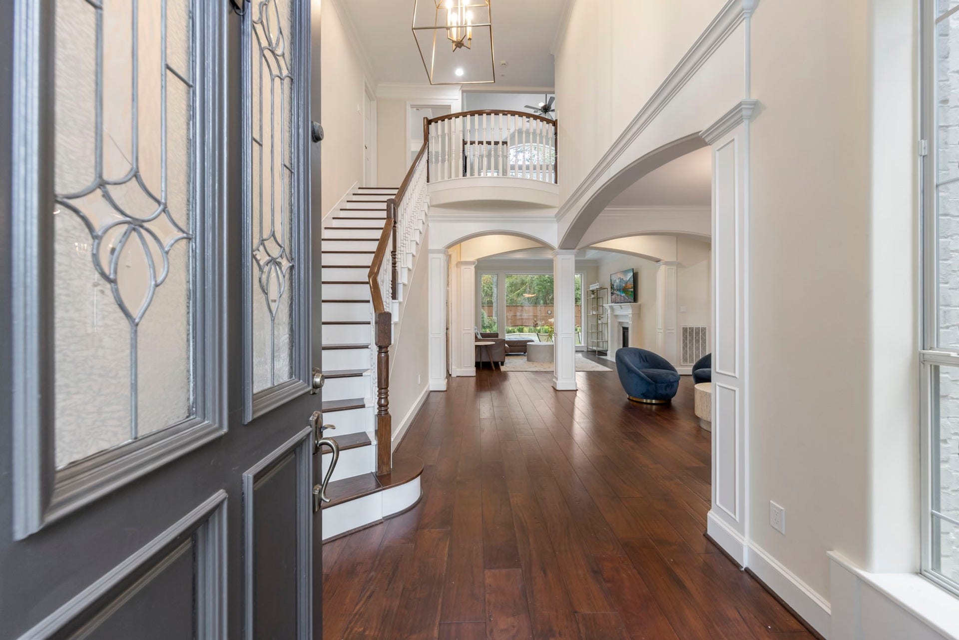 90 W Horizon Ridge Place, Spring, TX 77381 Enter to grand stairway and two-story foyer boasting ample natural light and gleaming wood floors.
