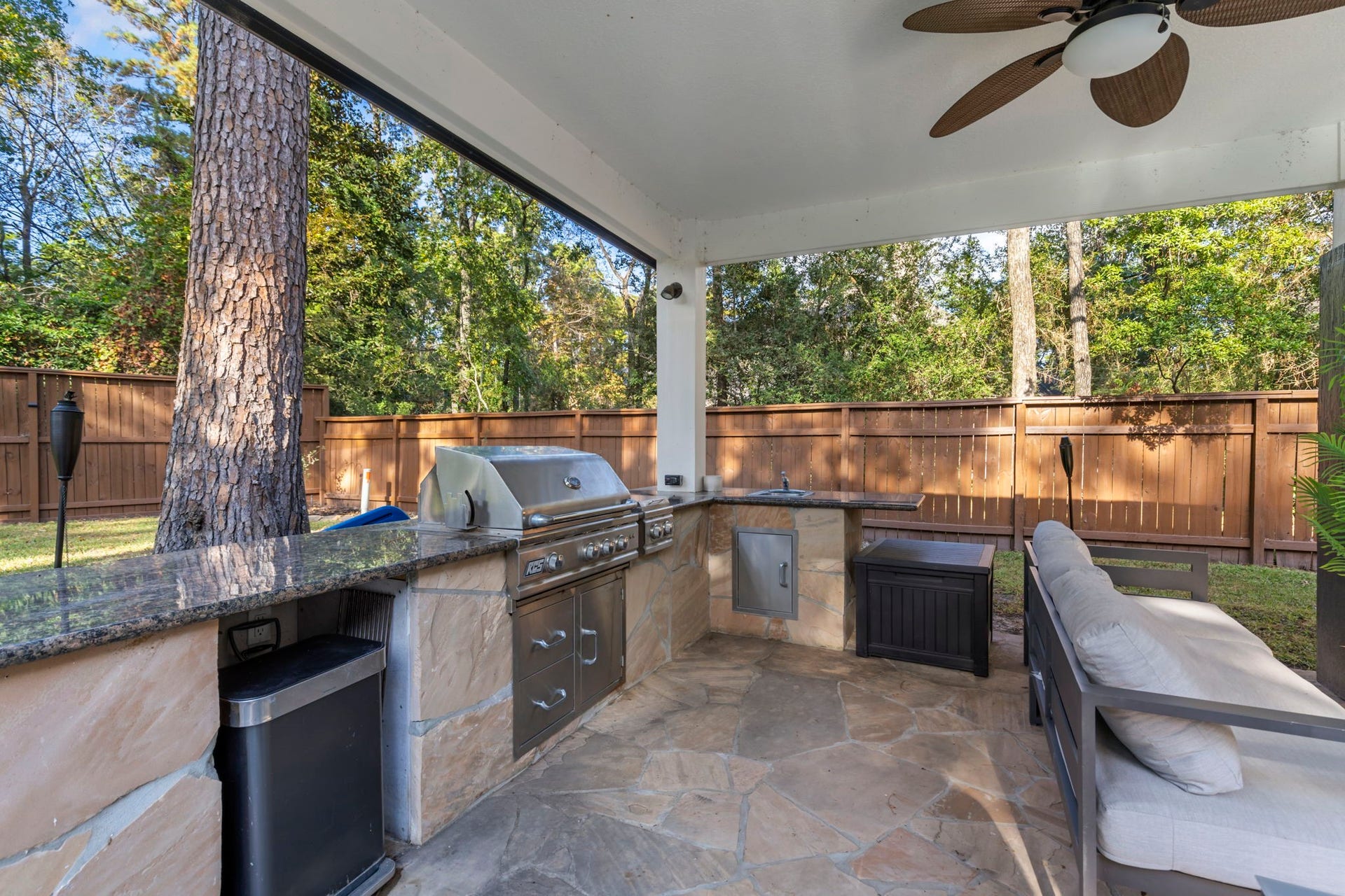 90 W Horizon Ridge Place, Spring, TX 77381 No Texas backyard is complete without a summer kitchen equipped with granite countertops, a gas grill, and cooktop burnersideal for family cookouts and year-round grilling!