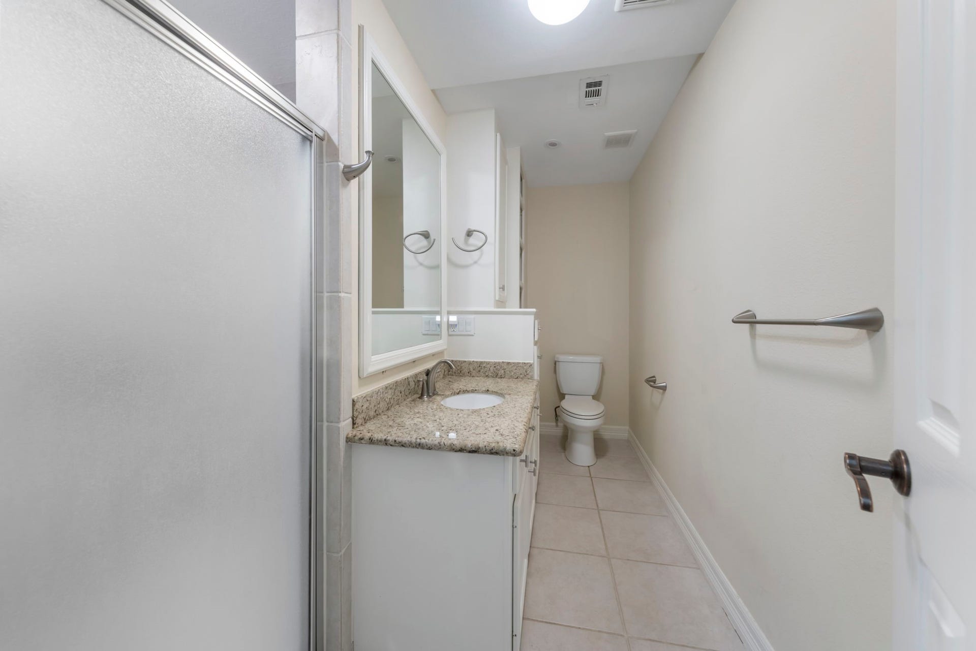 90 W Horizon Ridge Place, Spring, TX 77381 Ensuite bath provides stand up shower, ample storage, and timeless granite countertops.