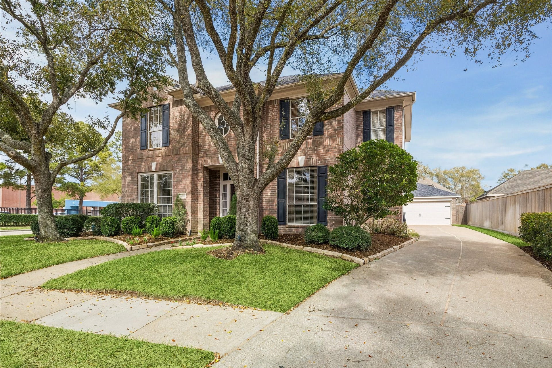 5310 Summerland Ridge Court, Houston, TX 77041 This home has a long driveway offering plenty of parking and a detached garage.