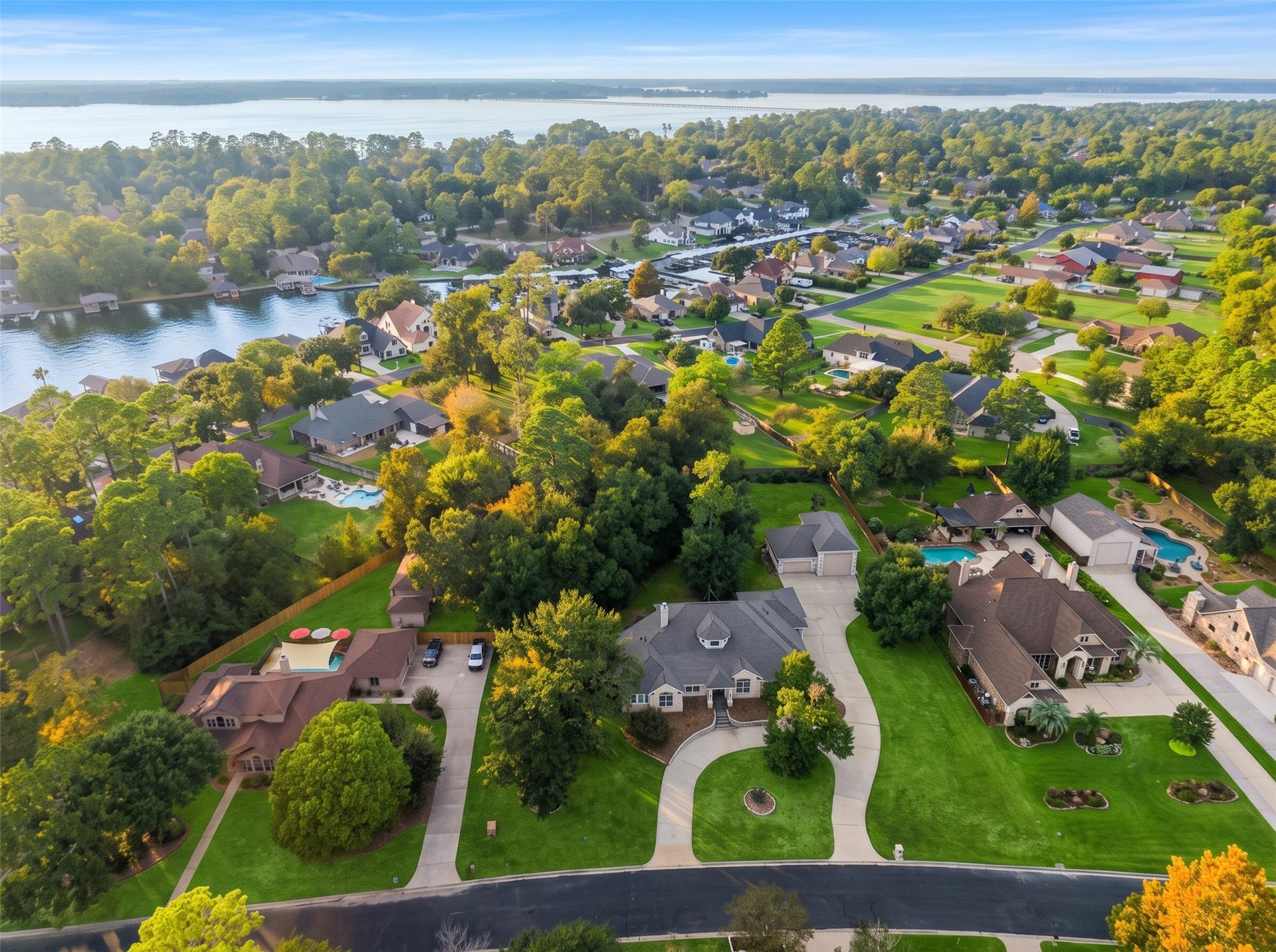 12195 N Lake Vista Drive, Willis, TX 77318 Nestled in a serene, tree-lined neighborhood, this stunning property offers lush landscaping and proximity to a tranquil lake, ideal for those seeking a peaceful retreat.