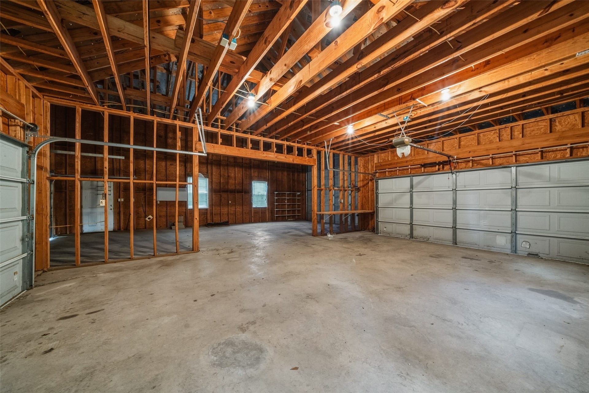 12195 N Lake Vista Drive, Willis, TX 77318 Bright and inviting bedroom featuring large windows, neutral walls, and a ceiling fan, offering a cozy and comfortable retreat.