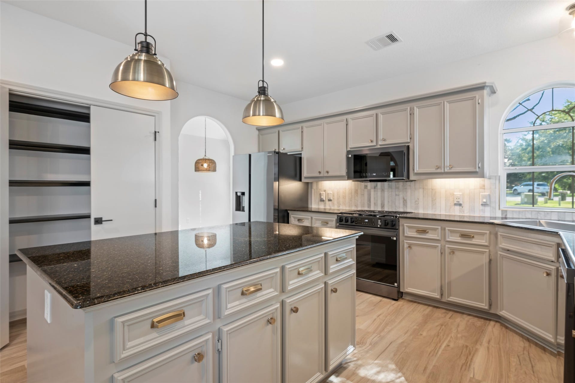 28614 Water Park Way, Spring, TX 77386 Sleek granite counters, brand new appliances and designer light fixtures