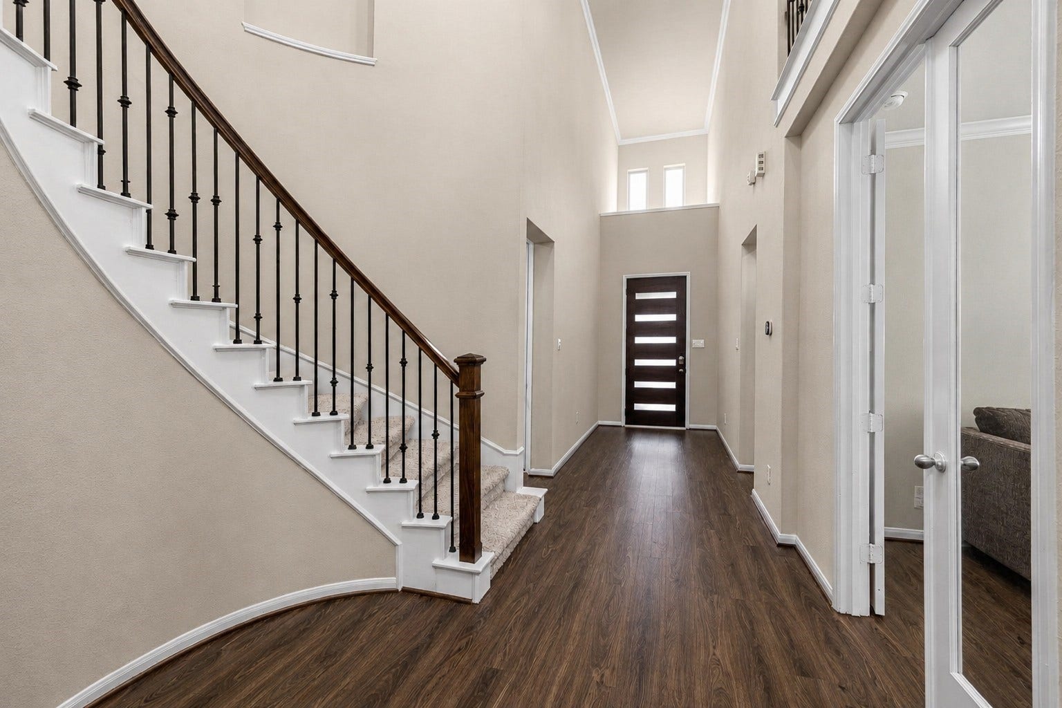 View of the entry with office to the right at the French doors