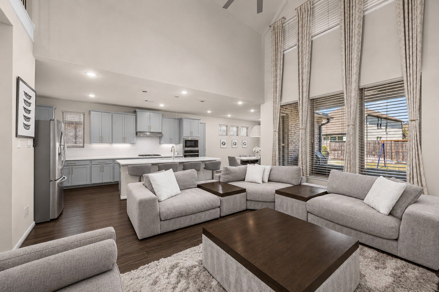 Custom curtains, modern fixtures and custom cabinets are a great view in this home