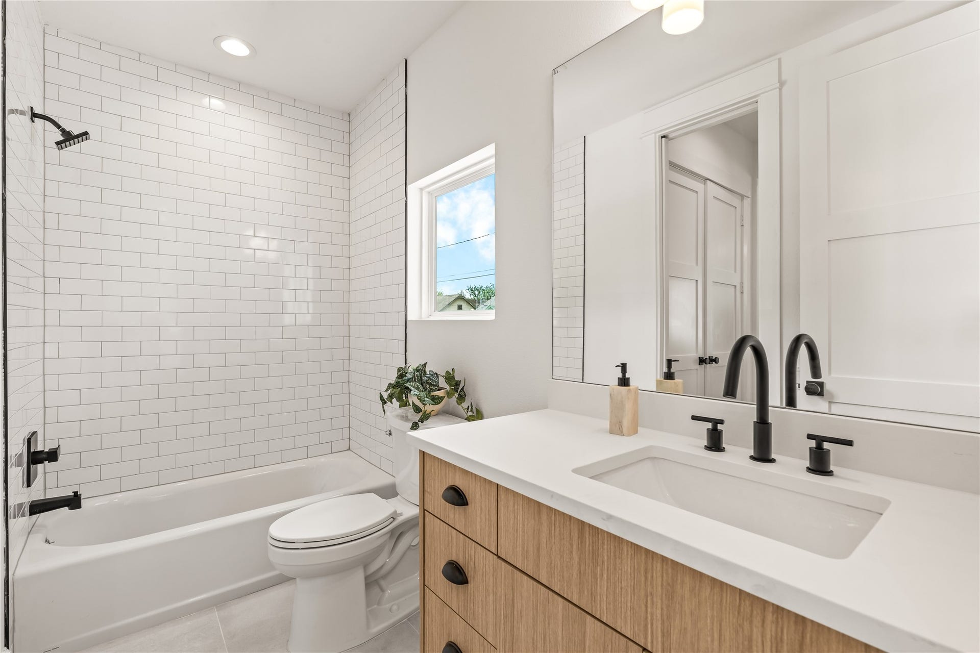 7432 & 7444 Tremper Street, Houston, TX 77020 First-floor full bath three full baths in this home, matte black hardware, tiled shower