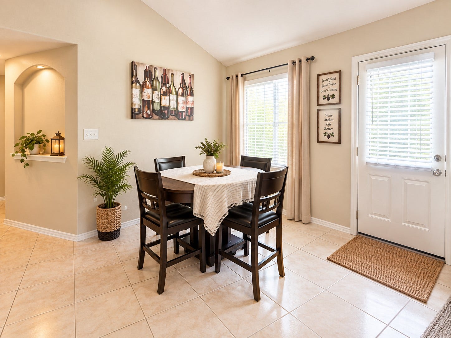 18234 Eton Ridge Court, Richmond, TX 77407 Bright dining area with a cozy table set, elegant decor, and abundant natural light from large windows, creating a warm and inviting atmosphere.