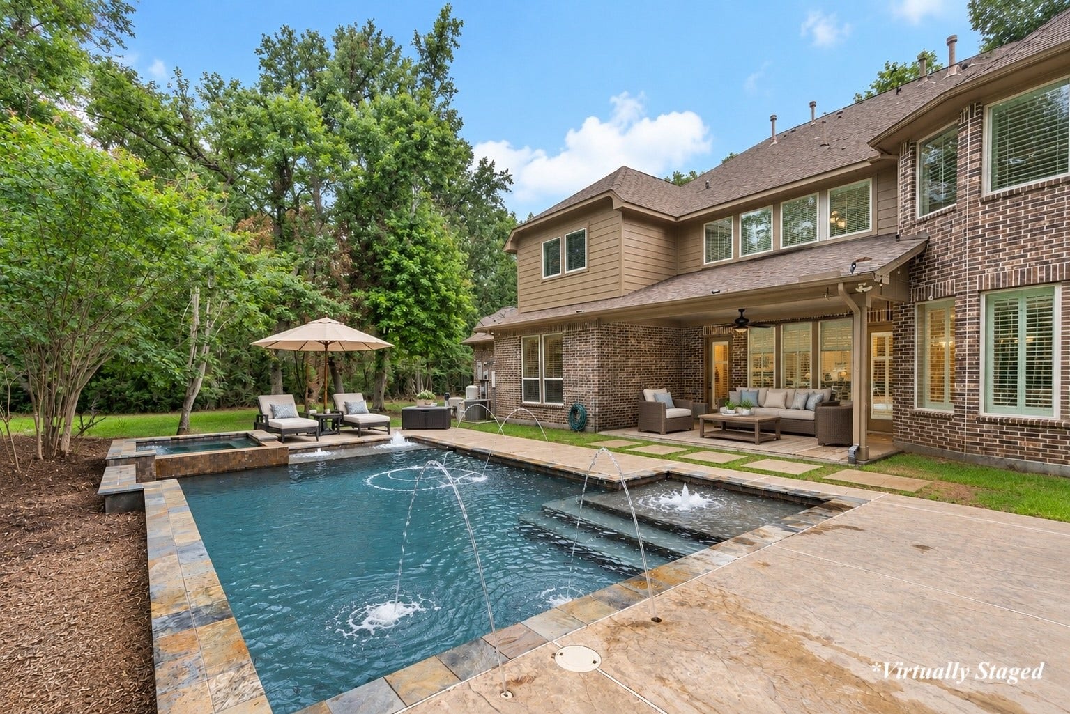 27015 Hidden Grove Landing Drive, Spring, TX 77386 Surrounded by mature trees and two private acres, the pool area offers a peaceful setting to relax and enjoy the natural beauty of the property. *Virtually Staged