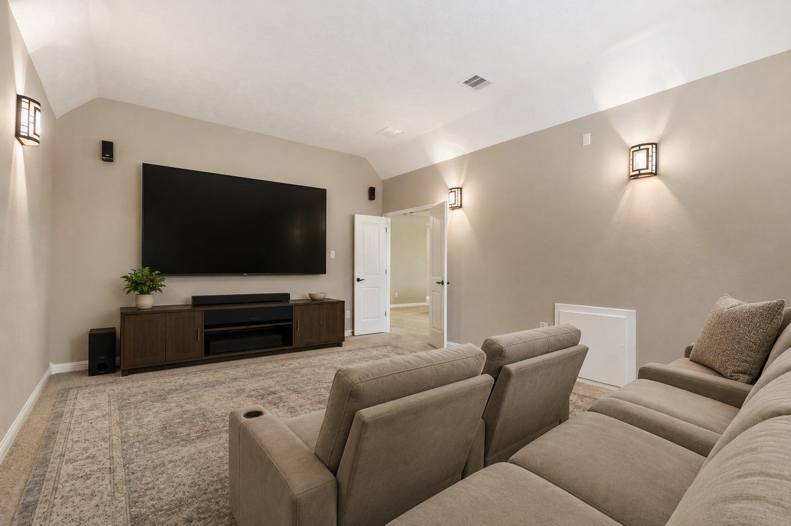27015 Hidden Grove Landing Drive, Spring, TX 77386 Dedicated Media Room with French door entry, surround sound speakers, wired for projector, sconce lighting, and carpeted flooring for a true theater feel. *Virtually Staged Image