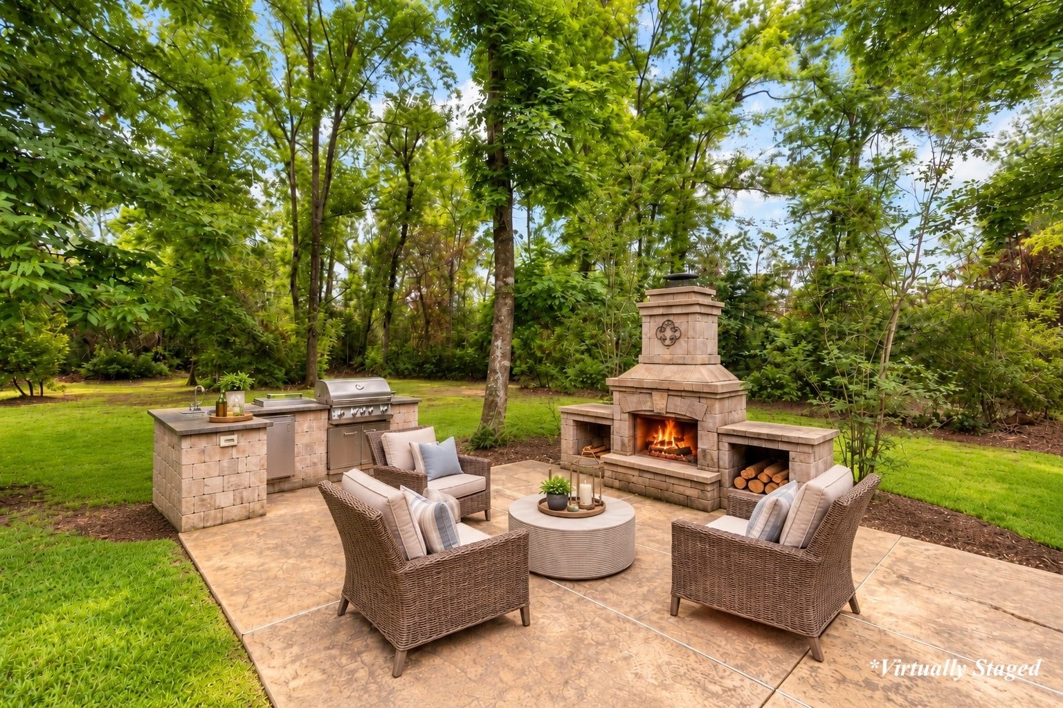 27015 Hidden Grove Landing Drive, Spring, TX 77386 A standout outdoor entertaining space featuring a stone fireplace, built-in grill, sink, generous prep space, and a tranquil wooded backdrop for year-round enjoyment.*Virtually Staged