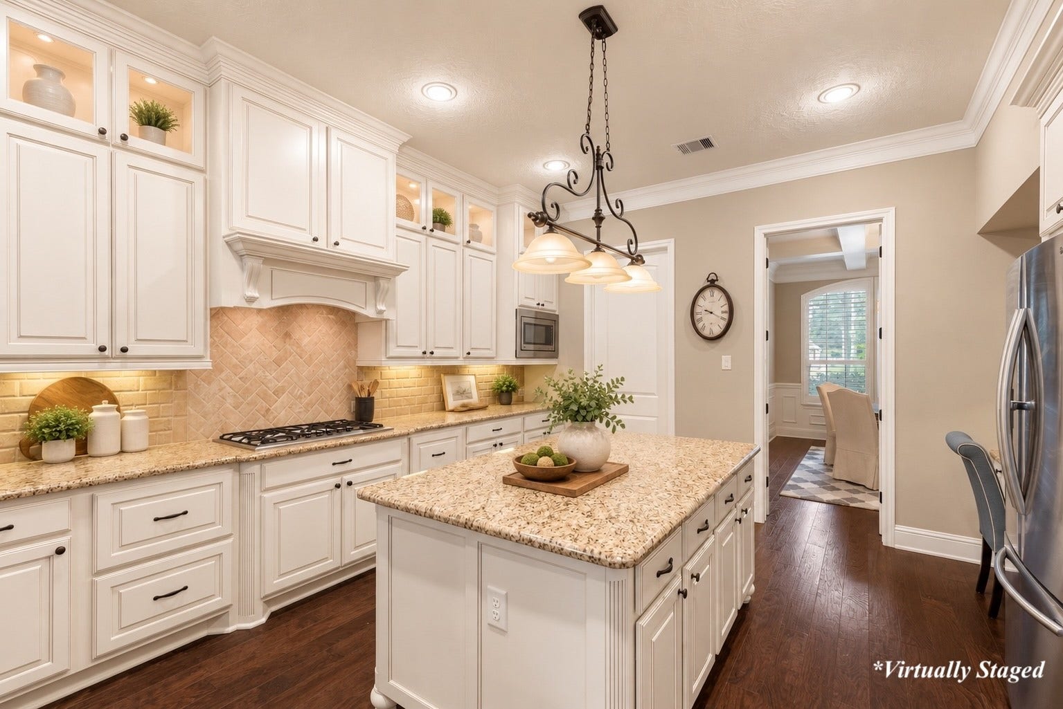 27015 Hidden Grove Landing Drive, Spring, TX 77386 Chef's Kitchen with double ovens, 5-burner gas cooktop, oversized island and walk-in pantry. *Virtually Staged decor accents
