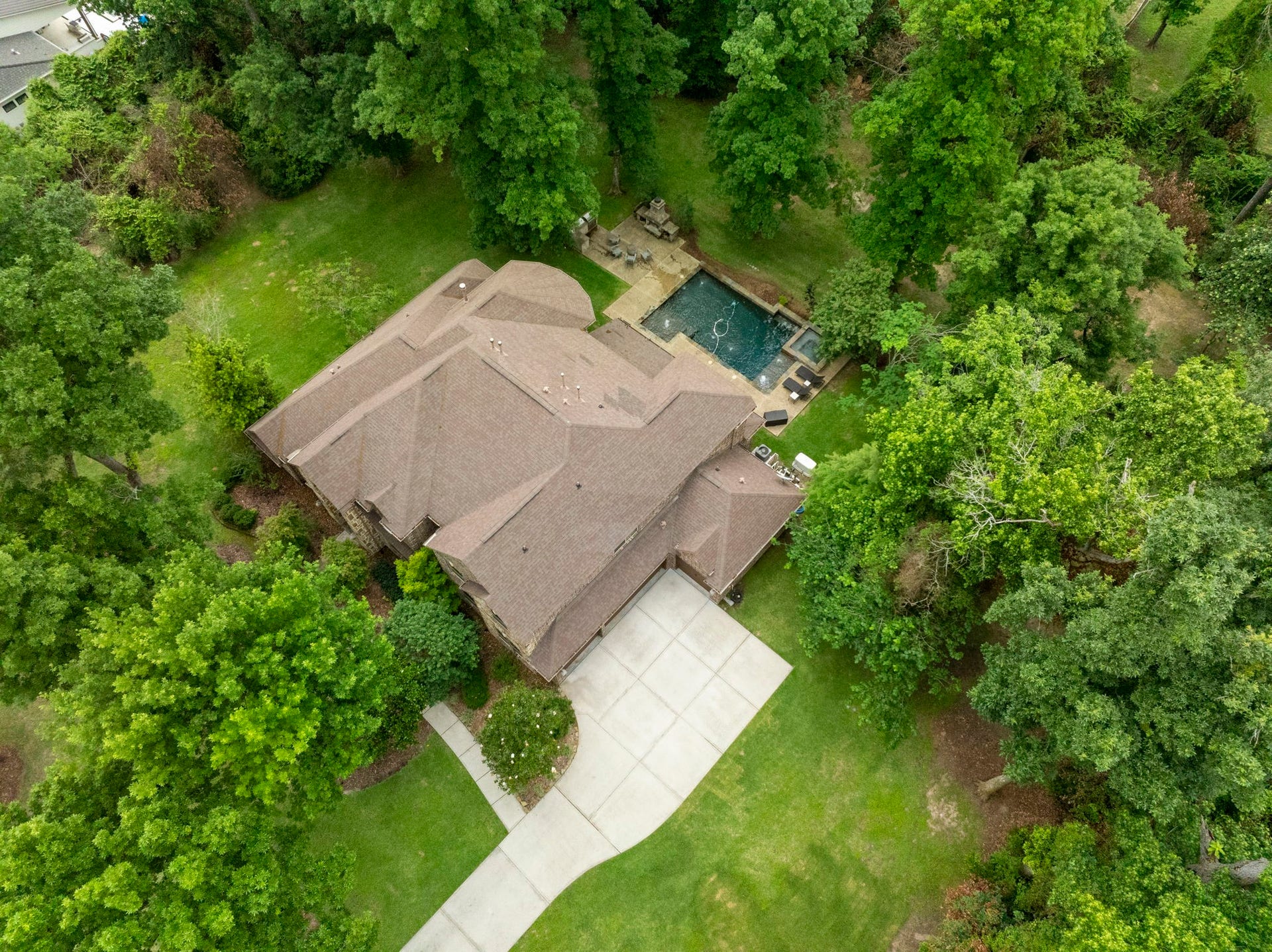 27015 Hidden Grove Landing Drive, Spring, TX 77386 Expansive backyard framed by mature trees, offering exceptional privacy and plenty of room for a playset, trampoline, or future outdoor additions.