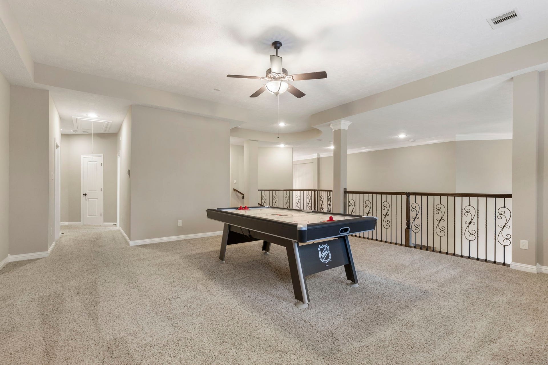 27015 Hidden Grove Landing Drive, Spring, TX 77386 Spacious upstairs Game Room with tray ceiling, backyard views, and open sight-lines to the Family Room below.