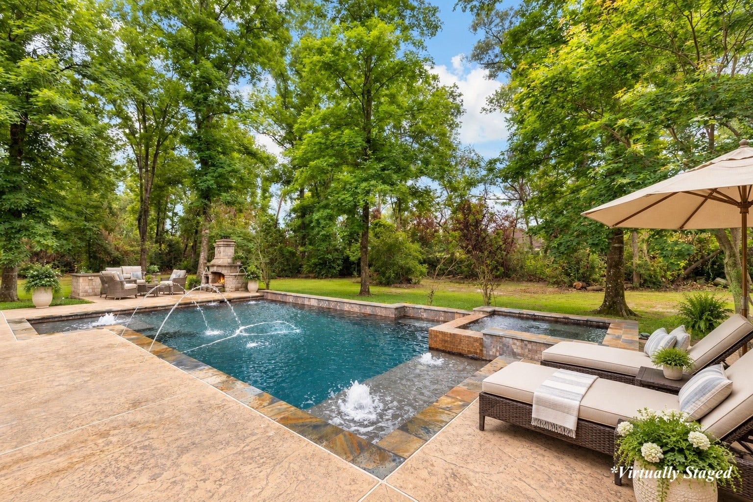 27015 Hidden Grove Landing Drive, Spring, TX 77386 Saltwater pool and spa featuring a tanning ledge, bubblers, water features, and expansive decking with plenty of space for lounging and entertaining, and offering unmatched privacy. *Virtually Staged