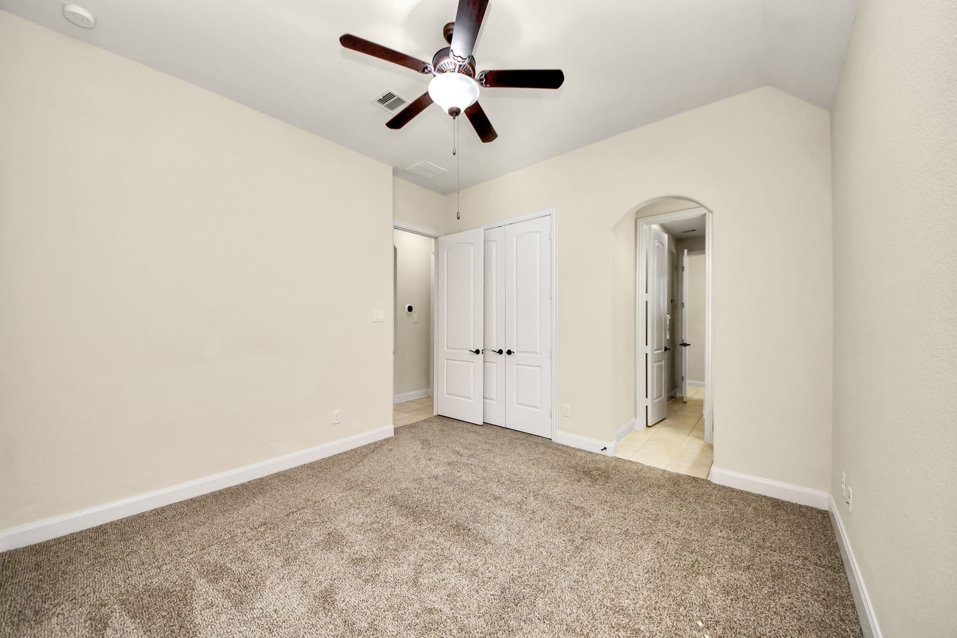 17307 Pentland Court, Richmond, TX 77407 This bedroom with Jack and Jill bathroom offers separate vanity spaces, providing privacy and ease for shared living.