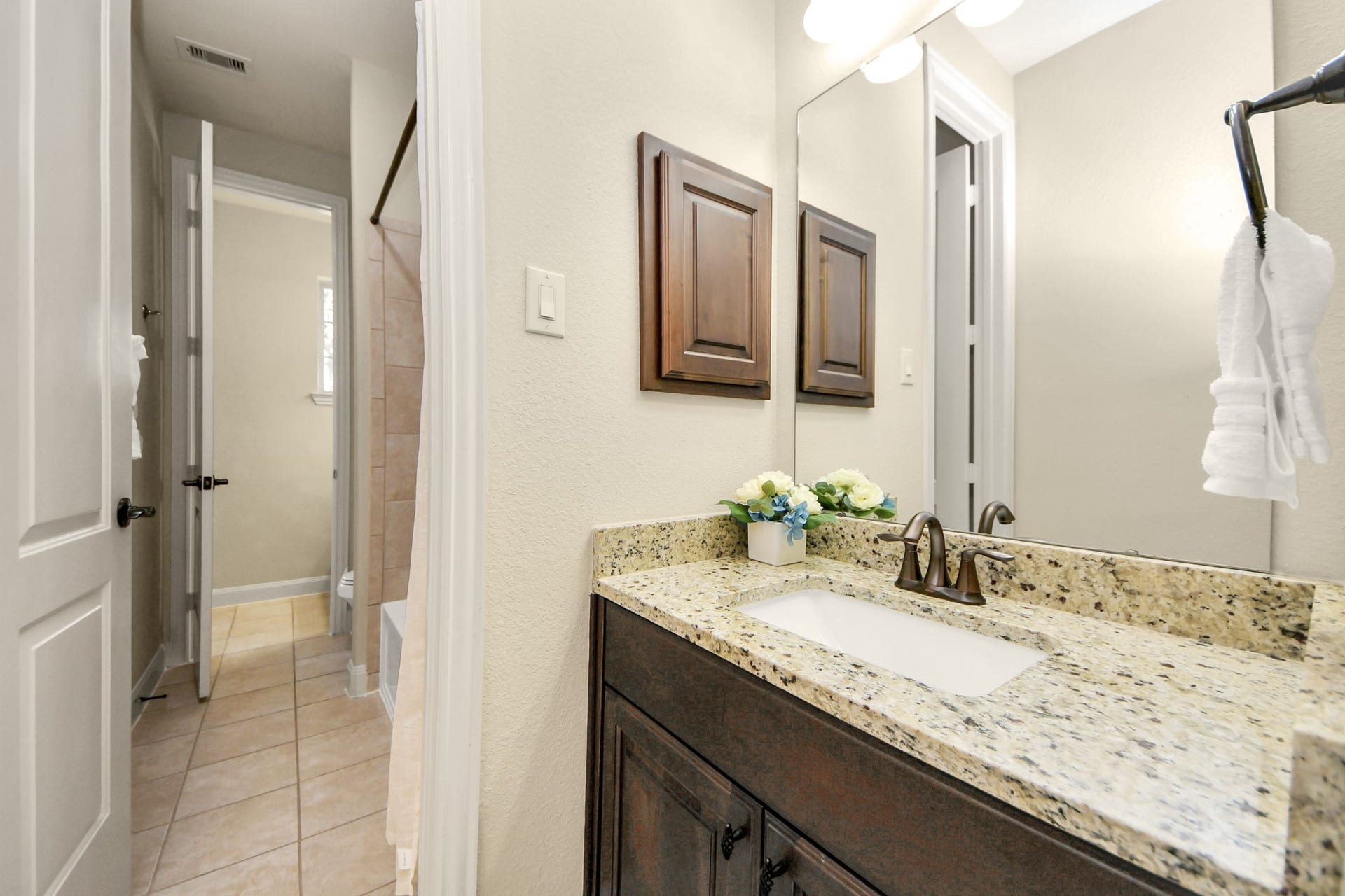 17307 Pentland Court, Richmond, TX 77407 This Jack and Jill bathroom with separate vanity provides privacy and ease in shared living.