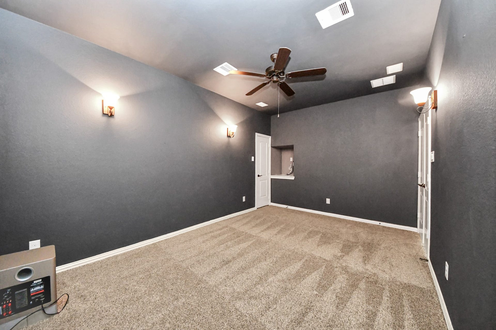 17307 Pentland Court, Richmond, TX 77407 Tucked behind French doors, this media room offers a private retreat perfect for movie nights.