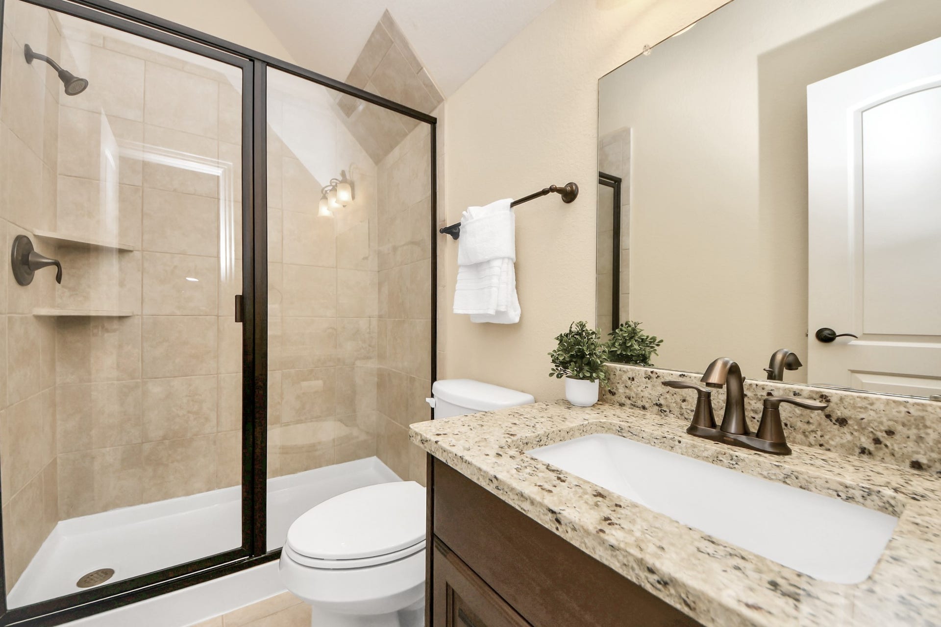 17307 Pentland Court, Richmond, TX 77407 The utility room with a built-in mud bench is ideally positioned at the owners entry from the garage, creating a practical drop zone for shoes, sports gear, and everyday attire before entering the home.