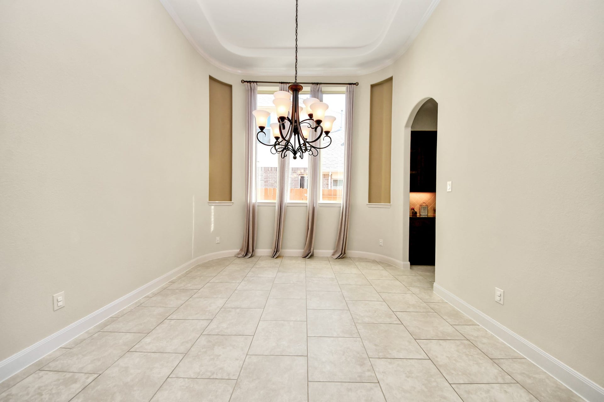 17307 Pentland Court, Richmond, TX 77407 The dining room opens gracefully to the home, accented by elegant ceiling details that add a touch of sophistication.