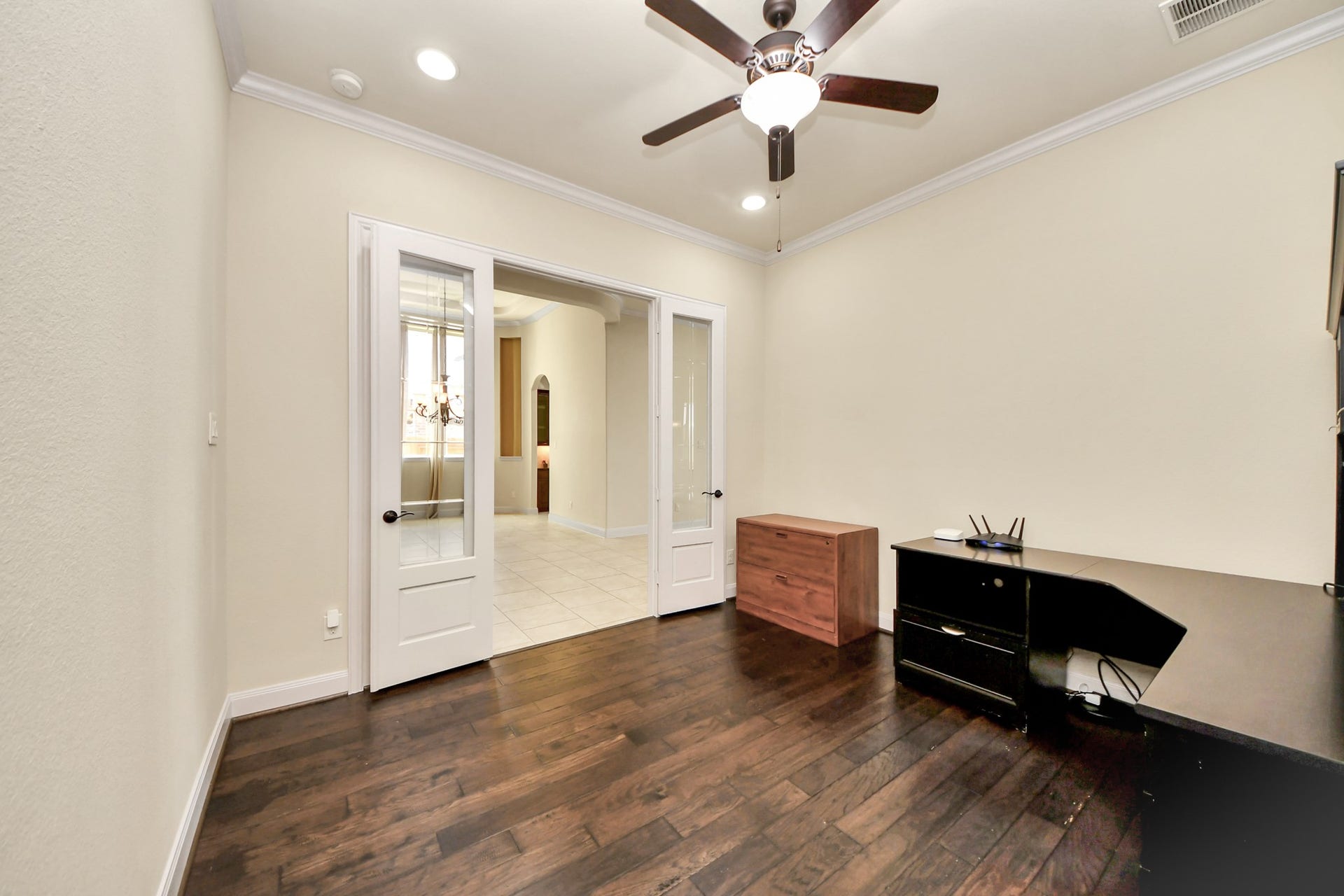 17307 Pentland Court, Richmond, TX 77407 Currently styled as a home office, this versatile flex space features elegant French glass doors and a spacious closet ideal for additional storage. Whether envisioned as a library, gym, or private retreat, its ready to be designed to fit your lifestyle.