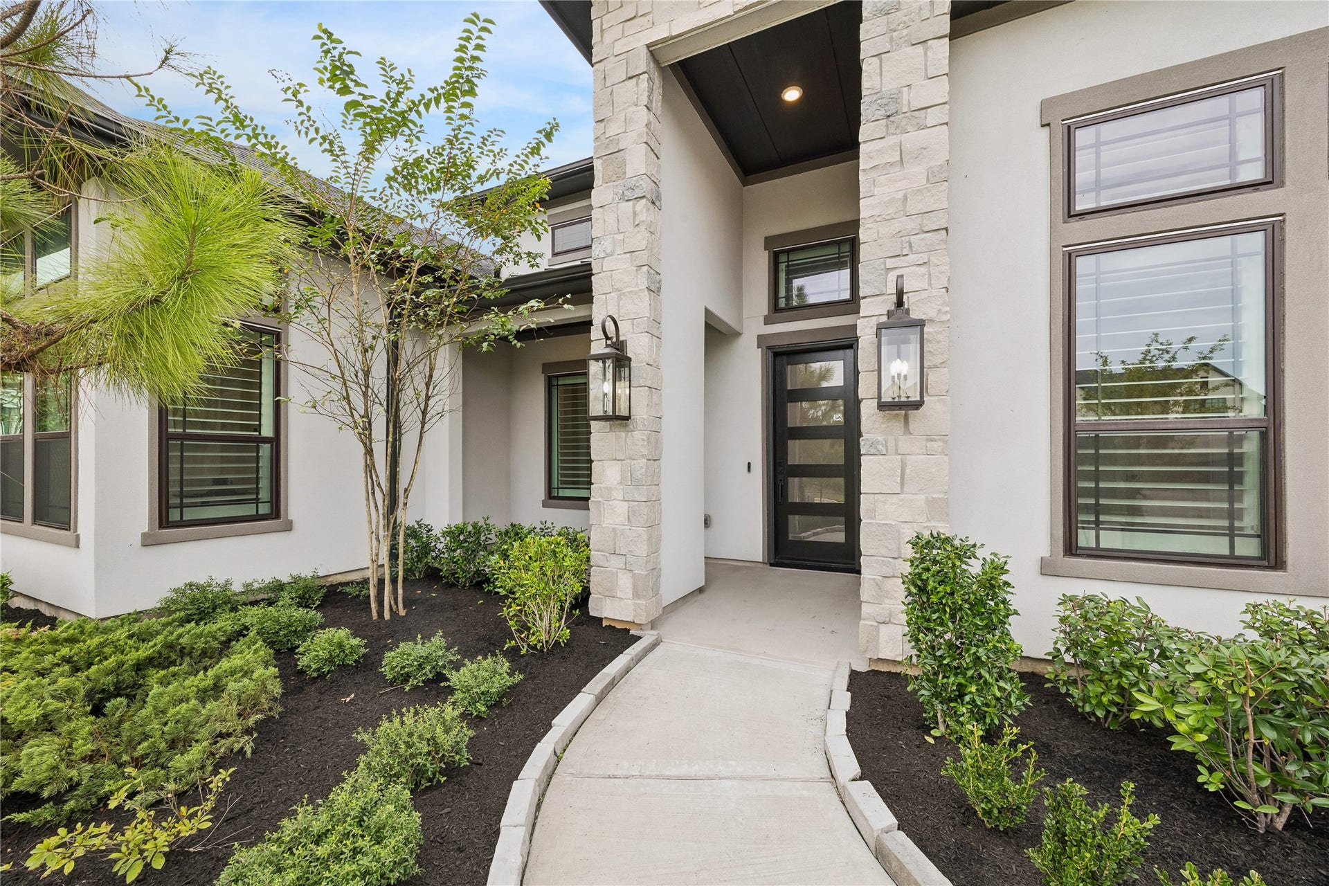 27720 Hazelbrook Lane, Spring, TX 77386 Fresh Landscaping leading up to your luxurious Toll Brothers One-Story Home