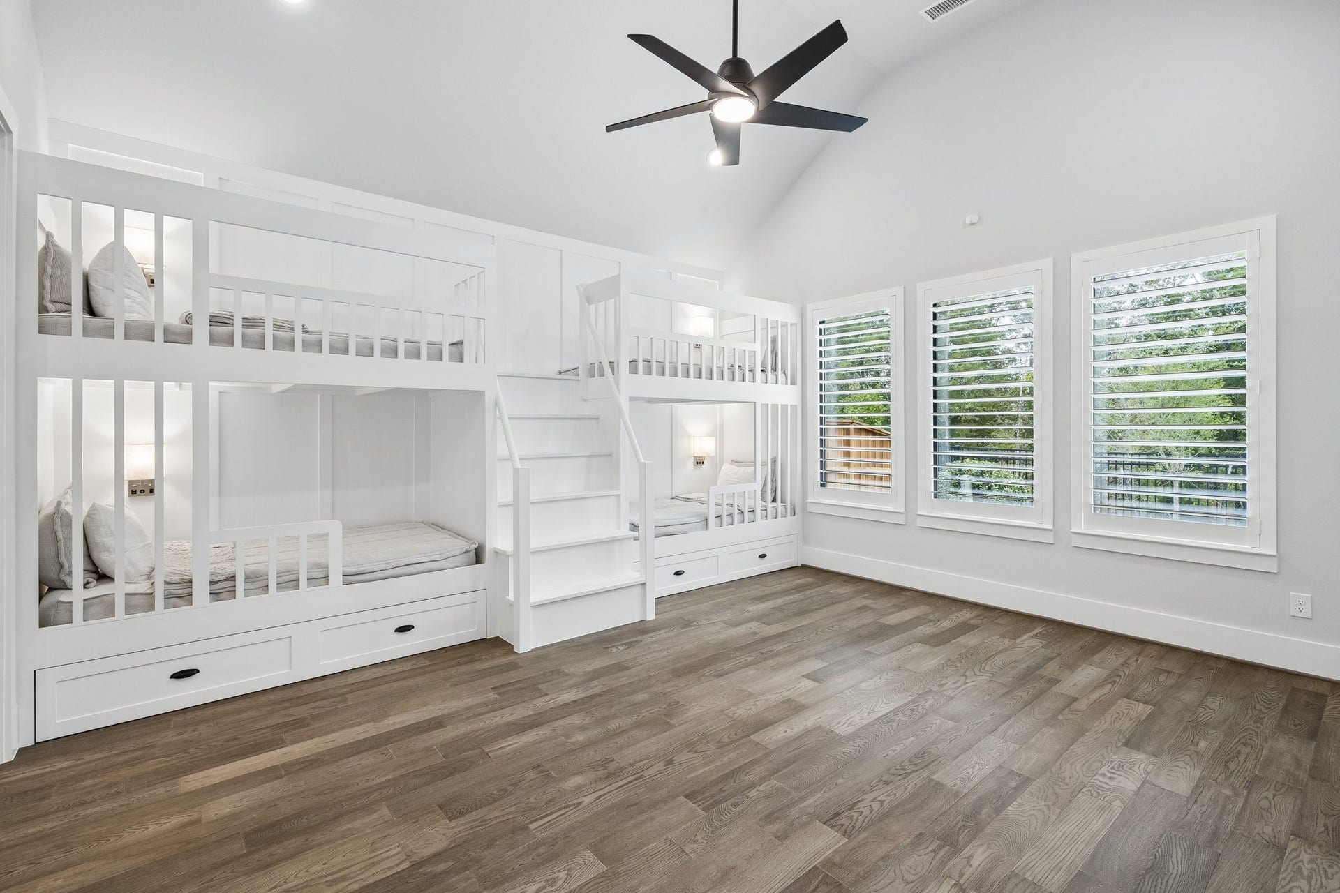 27720 Hazelbrook Lane, Spring, TX 77386 Your massive Gameroom features professionally designed bunk beds. Notice the added sconces, upgraded ceiling fan, recessed lighting, plantation shutters & stunning view of mature trees. Plenty of room for additional seating/gaming in this room.