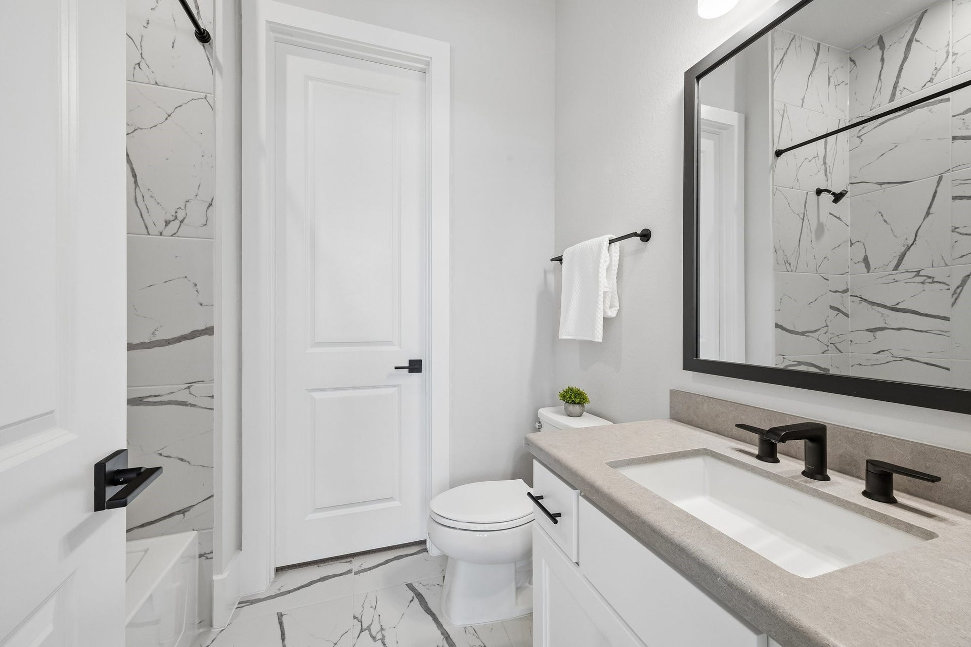 27720 Hazelbrook Lane, Spring, TX 77386 Full En-Suite and Walk-In Closet for the 2nd Bedroom. Notice the floor to ceiling tile and upgraded modern fixtures and mirror.