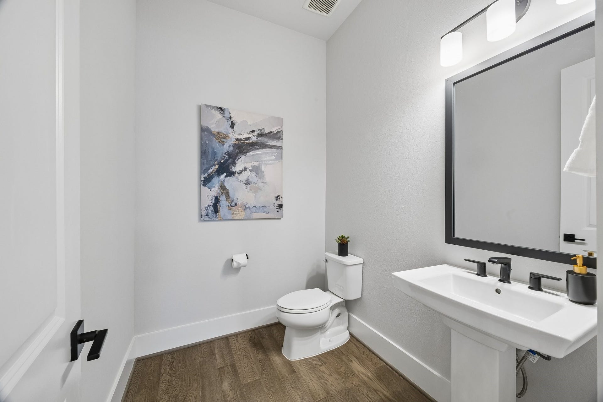 27720 Hazelbrook Lane, Spring, TX 77386 Your LARGE Powder Room is conveniently centrally located. Modern Pedestal Sink with Upgraded Faucets, Mirror and Fixtures