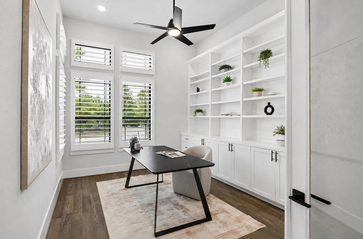 27720 Hazelbrook Lane, Spring, TX 77386 Your impressive 15'x12' (approximate) Office is lined with beautiful windows letting in a wonderful amount of natural light. Upgraded Plantation Shutters, Modern Ceiling Fan, Recessed Lighting and a wall of Built-In Cabinetry & Shelving have been added to complete this room. There is also a wall mount behind the artwork in the photo for the option to easily mount a TV.