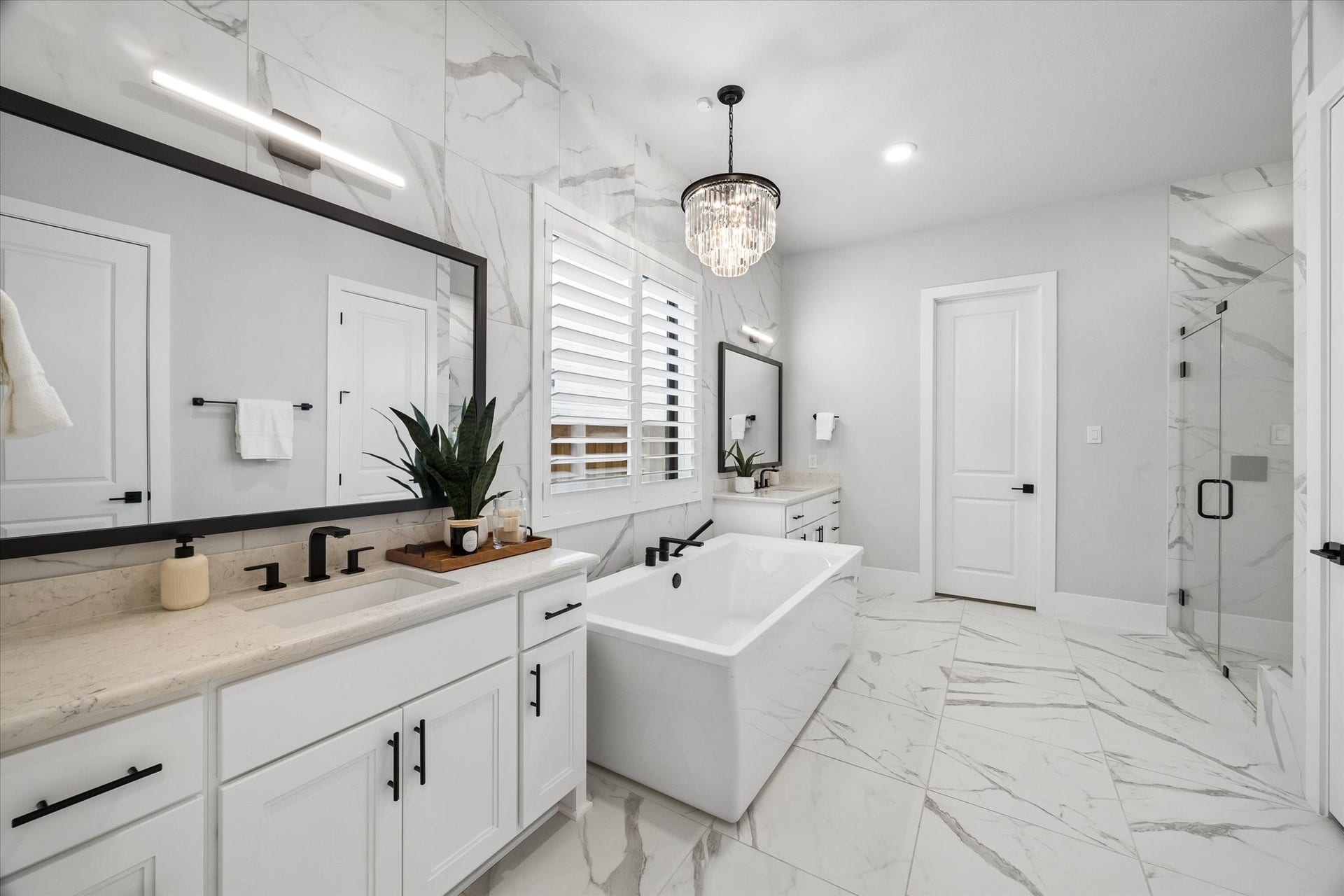 27720 Hazelbrook Lane, Spring, TX 77386 Your Primary Bathroom feels like a day at a luxurious spa! Large Freestanding Modern Soaking Tub with upgraded faucets and fixtures. Floor to Ceiling tile throughout & all upgraded high-end finishes
