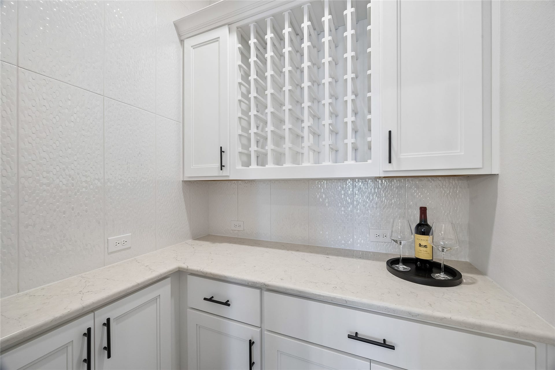 27720 Hazelbrook Lane, Spring, TX 77386 Beautiful Wine Room with stunning backsplash includes built-ins, cabinets and a good amount of counter space. Perfect for storage, entertaining and easy access from your Dining Room
