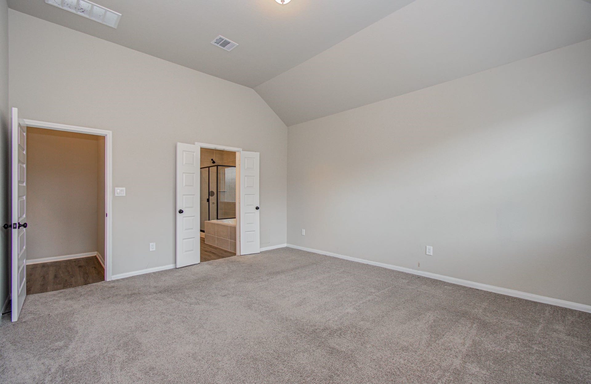 Another angle of the spacious primary bedroom