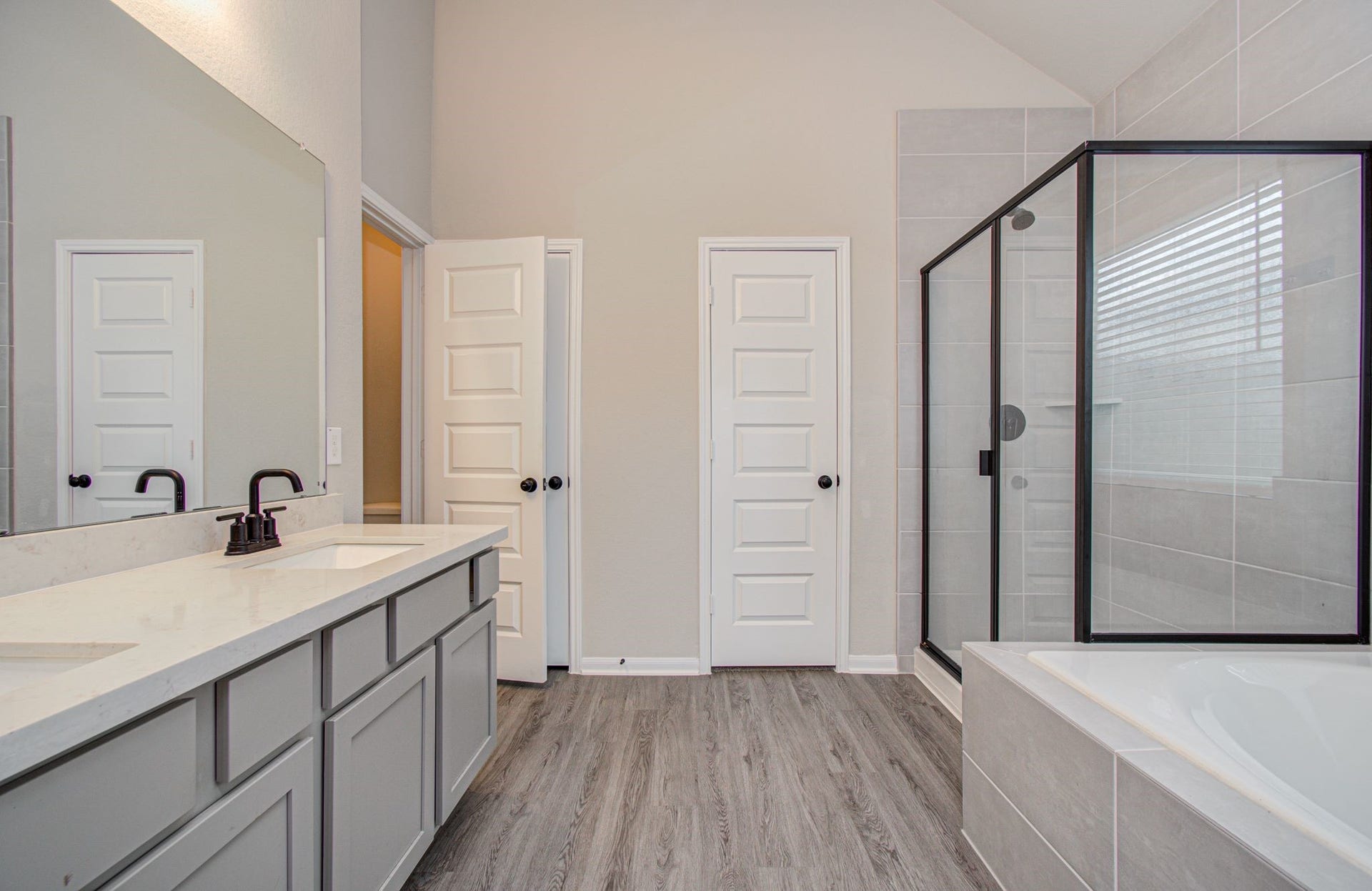 Spacious primary bath also includes separated privacy water closet