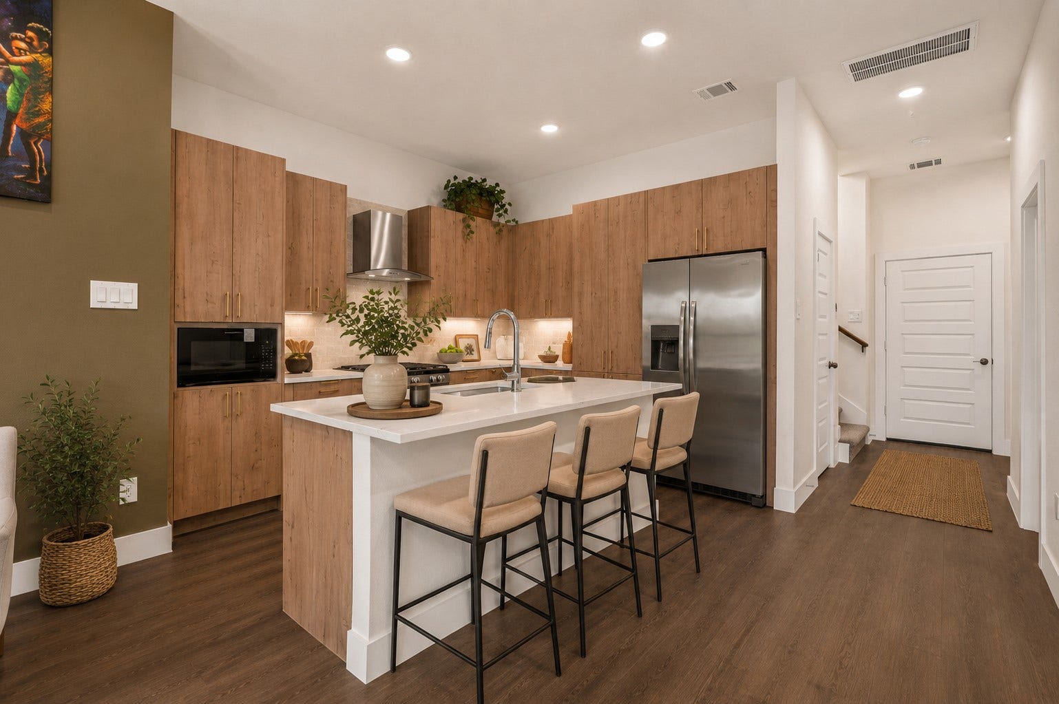 Contemporary island kitchen featuring quartz countertops, stainless steel appliances, soft-close cabinetry, and modern designer finishes throughout.