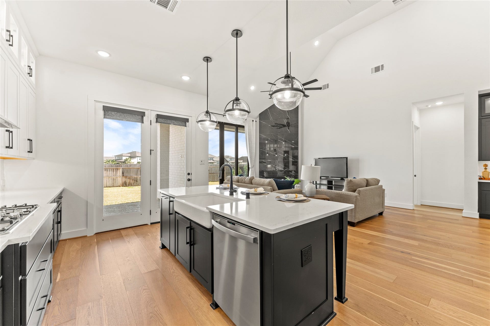 1934 Pleasant Grove Drive, Missouri City, TX 77459 The kitchens airy, open-concept design flows seamlessly into the living area and provides direct access to the outdoor patio through beautiful glass doors.