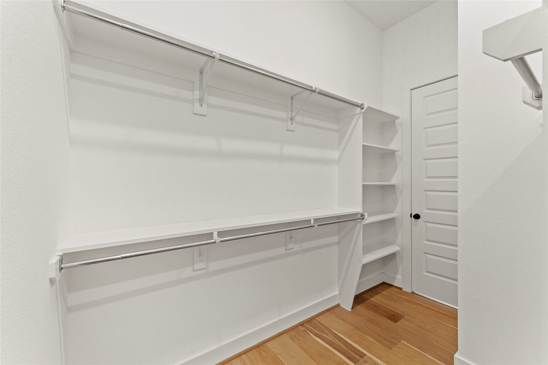 1934 Pleasant Grove Drive, Missouri City, TX 77459 Indulge in the ultimate organization experience with this massive walk-in closet featuring beautiful wood flooring and bright recessed lighting.
