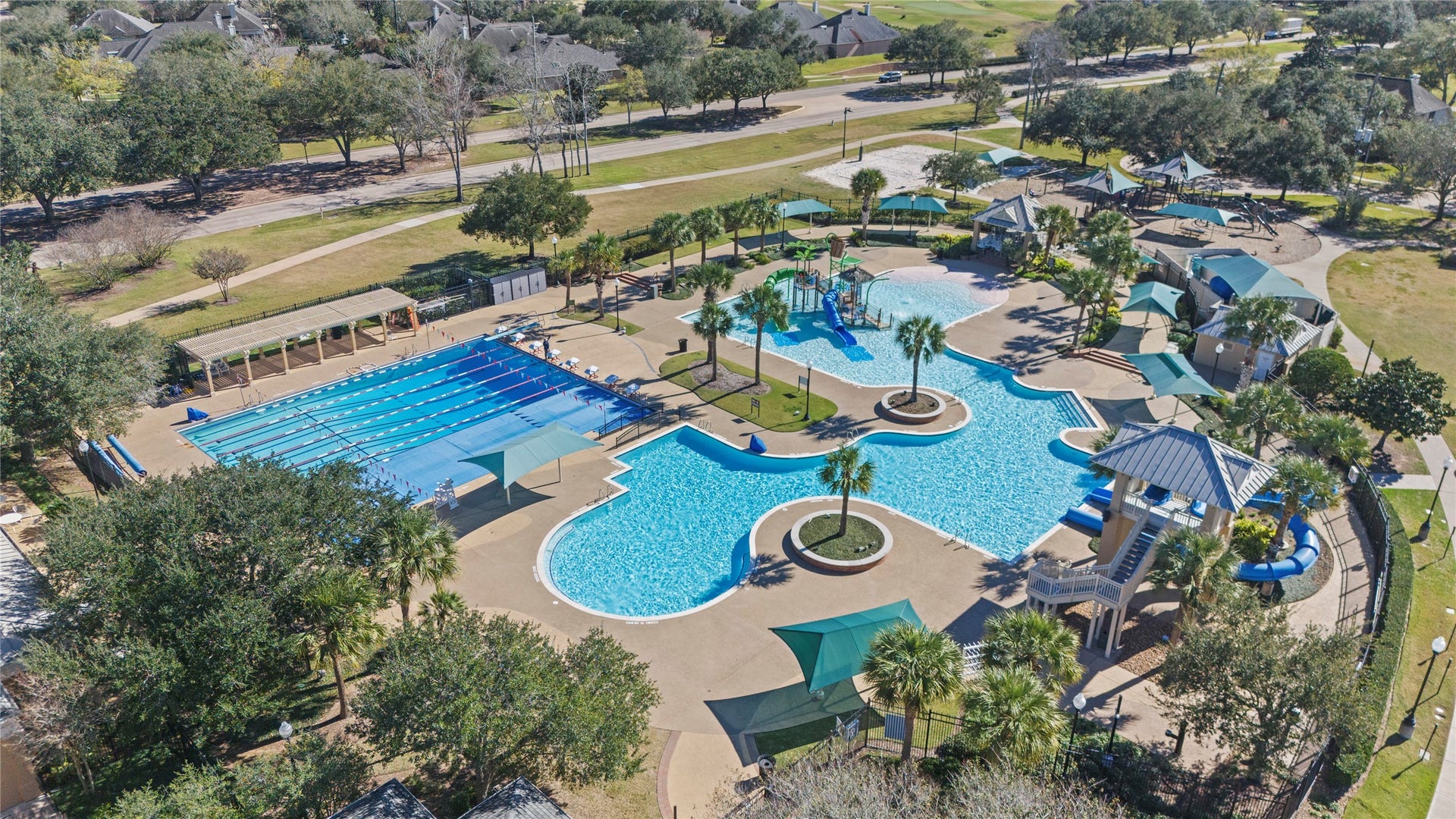 1934 Pleasant Grove Drive, Missouri City, TX 77459 Dive into an extraordinary resort-style lifestyle at the Club Sienna Water Park, featuring a massive lap pool, thrilling winding slides, and a fun-filled splash pad all surrounded by lush tropical landscaping.