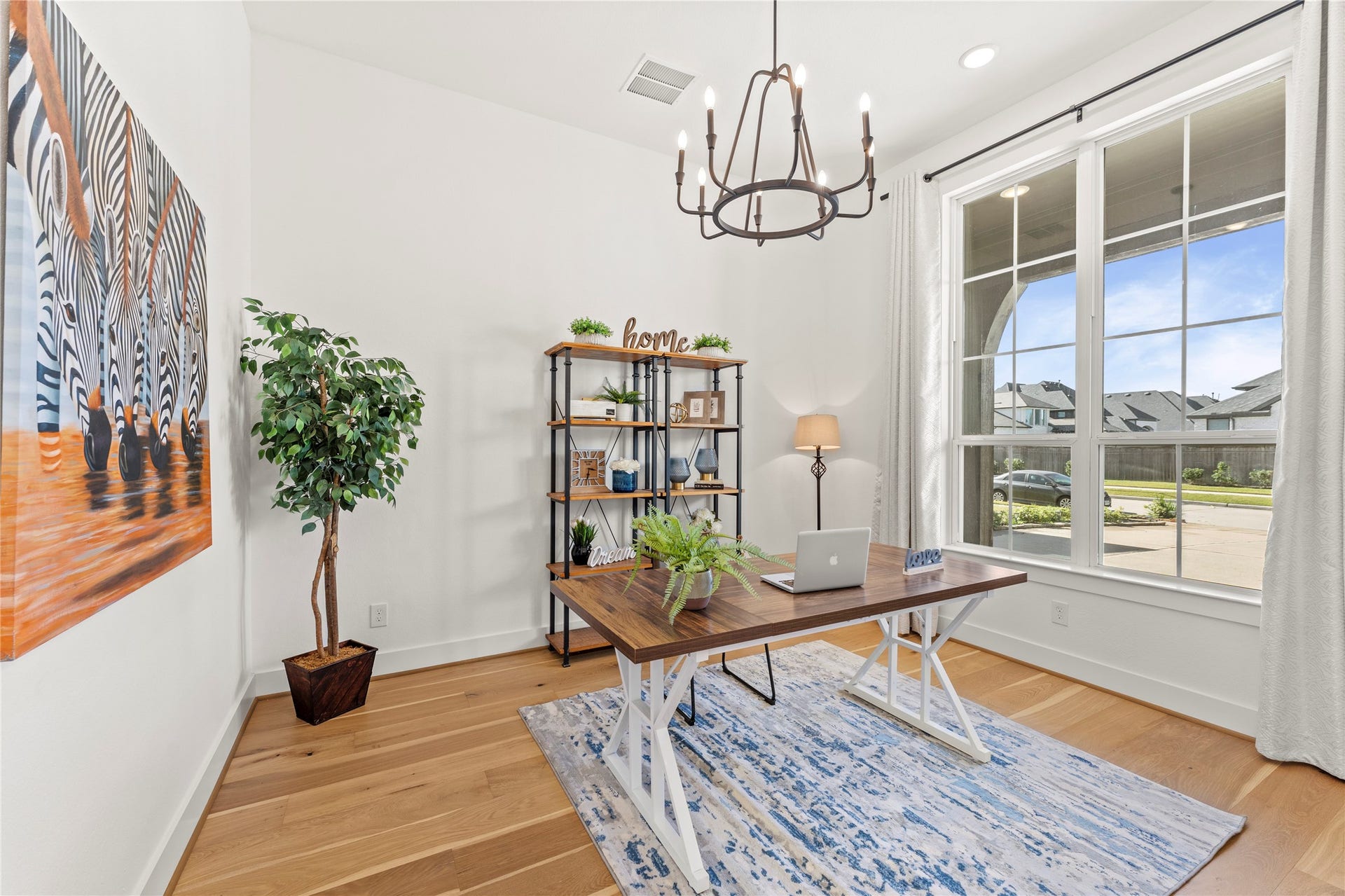 1934 Pleasant Grove Drive, Missouri City, TX 77459 Boost your productivity in this bright and airy home office featuring a massive window that fills the room with sunshine! Its the perfect quiet retreat for remote work or study, offering both privacy and a beautiful view of the surroundings.