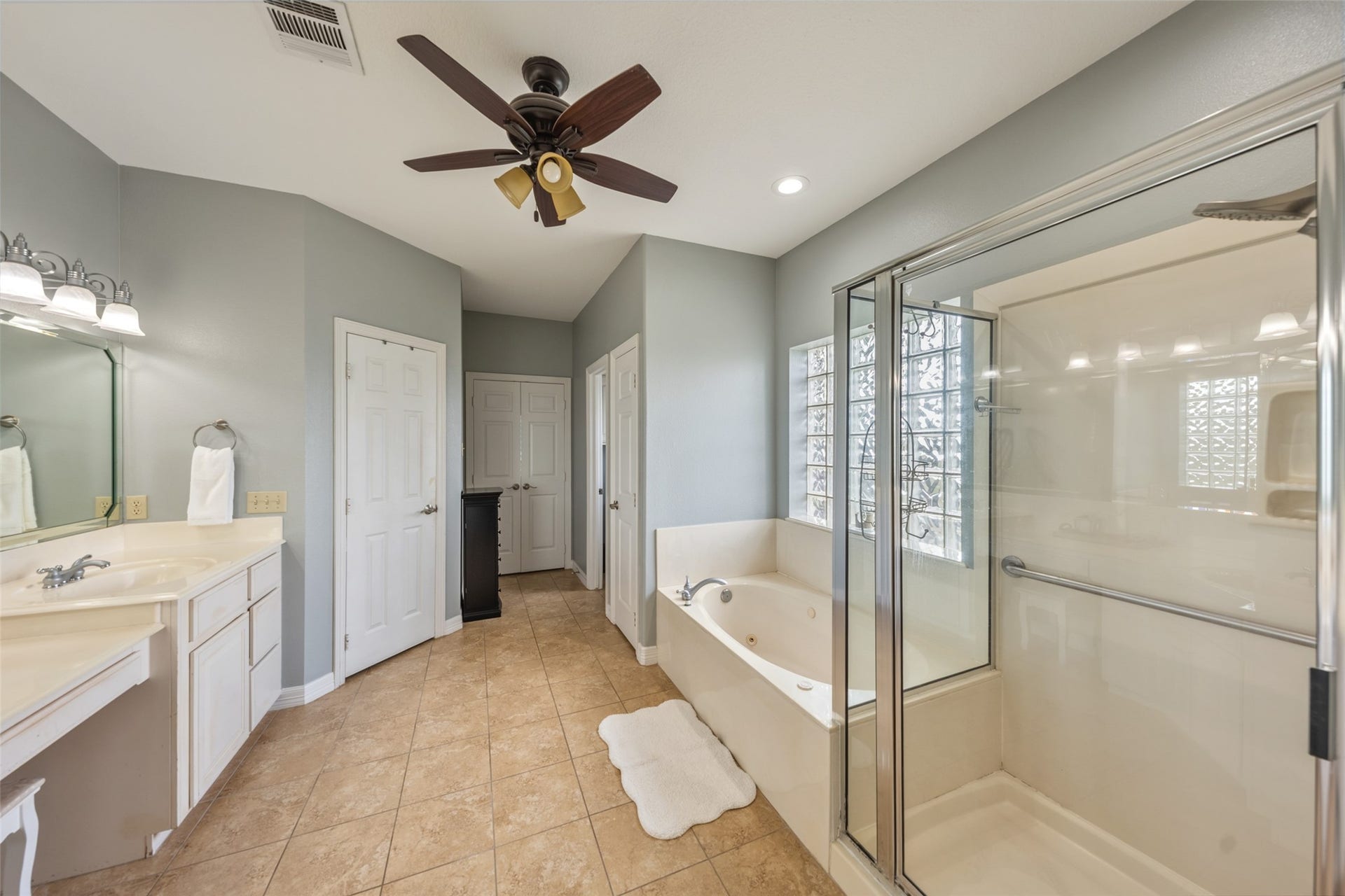 8775 Grand Lake Estates Drive, #77316, Montgomery, TX 77316 Walk in shower + his and her closets in primary