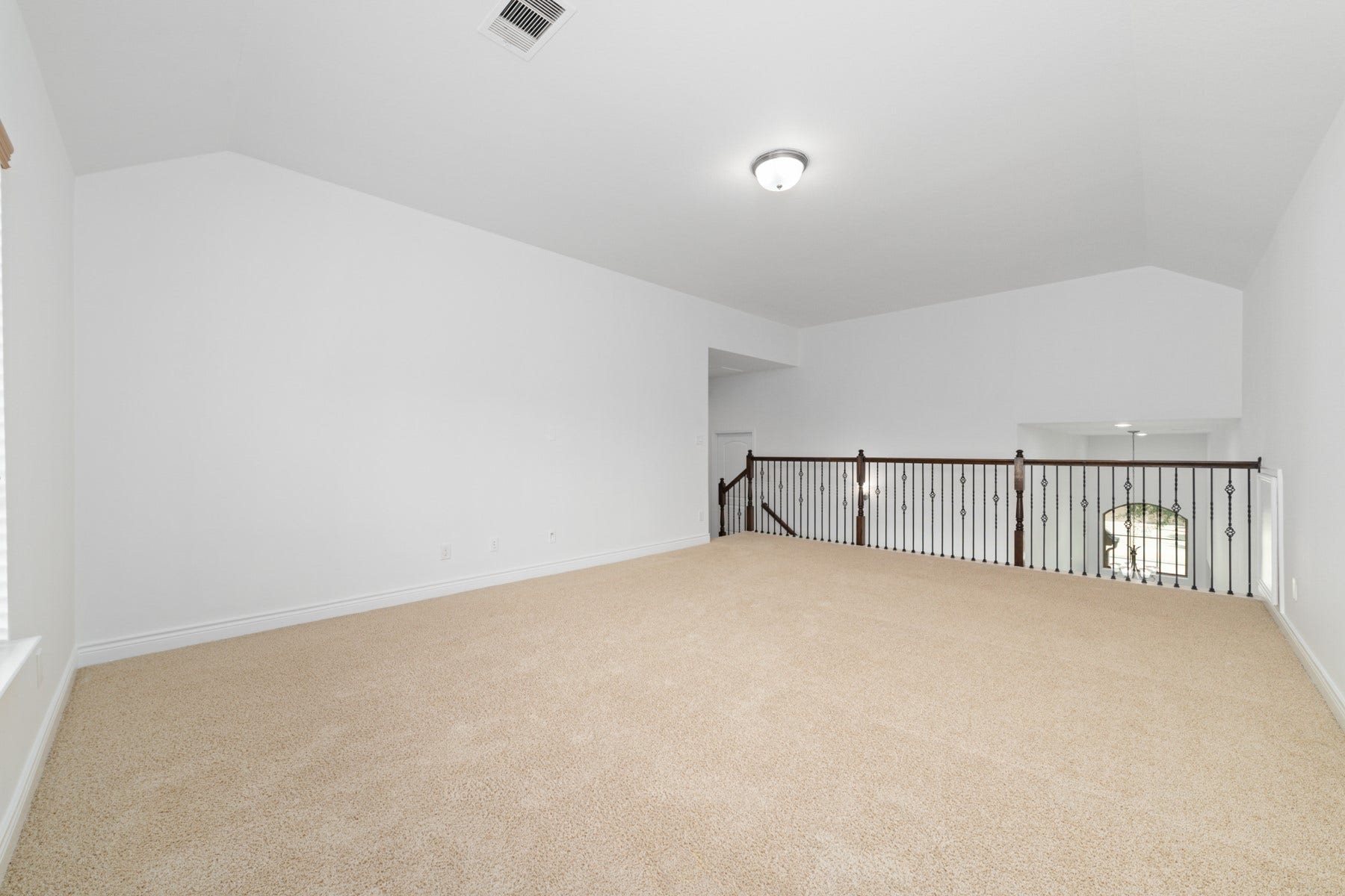 A captivating view overlooking the inviting family room below.