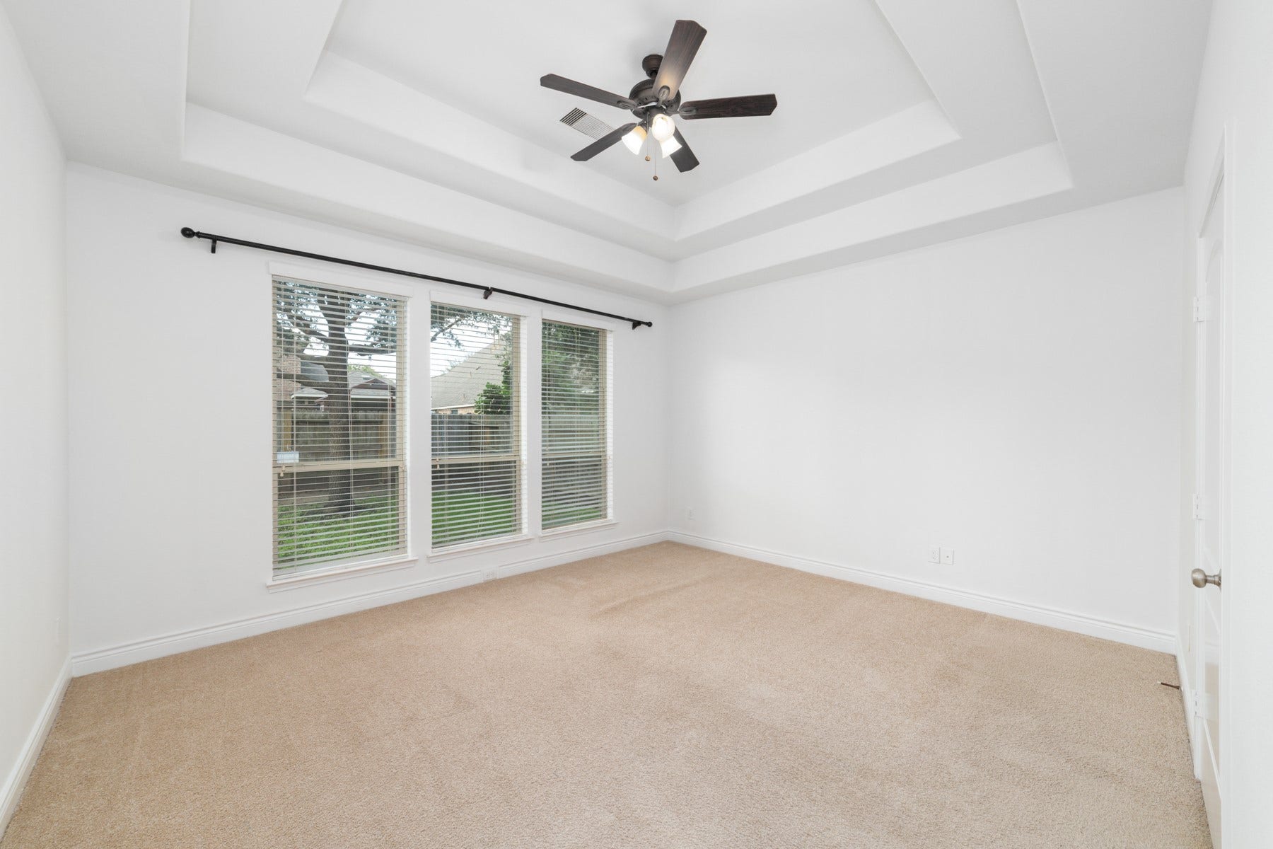 Modern recessed ceilings that enhance the master suite's contemporary feel.