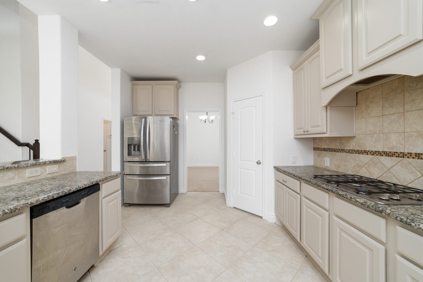 Stainless steel appliances, complete with a convenient water softener and filtration system at the sink.