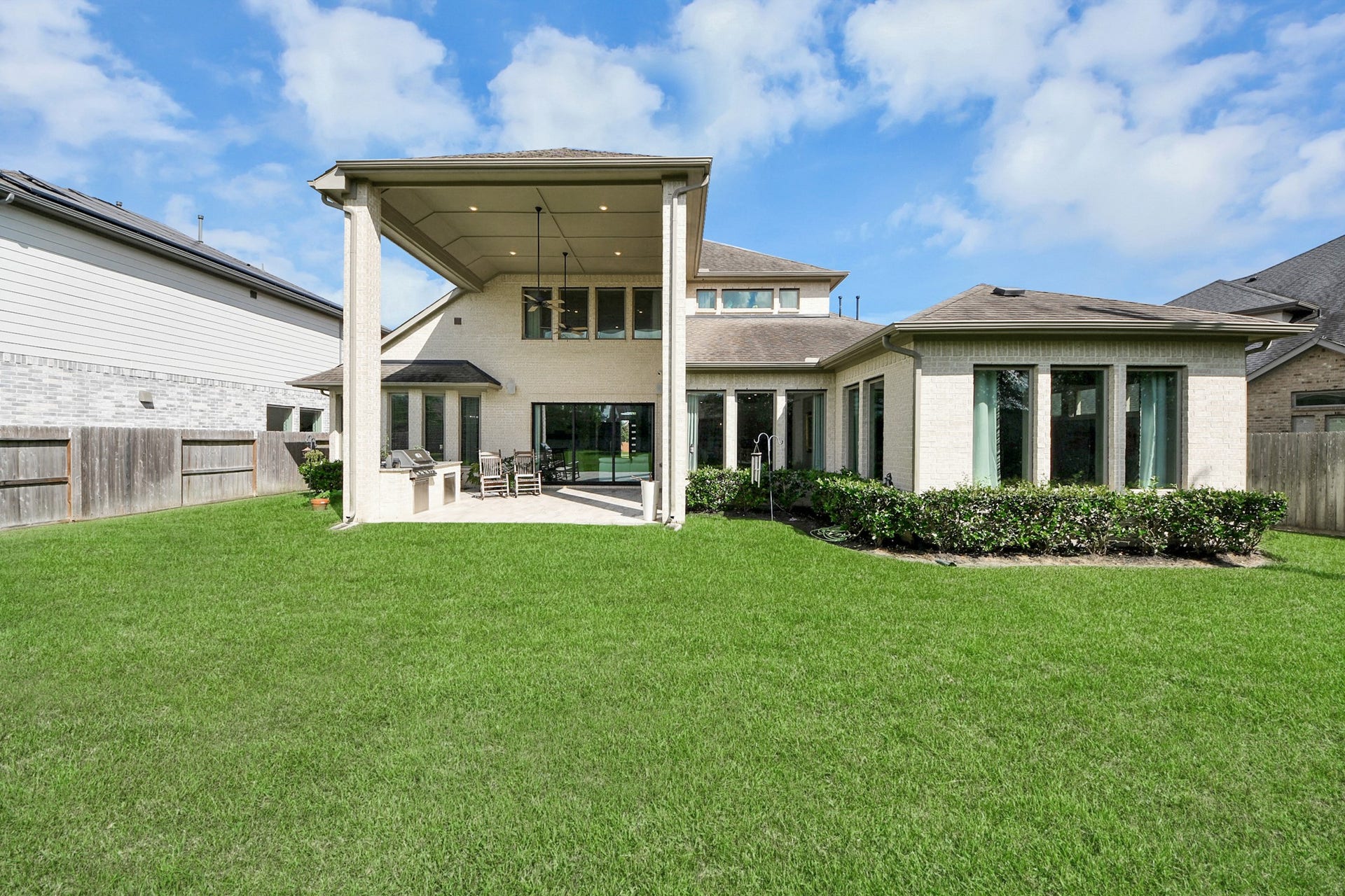 10611 Sawmill Park Drive, Missouri City, TX 77459 Backyard Elevation: Expansive covered patio overlooking a spacious backyard with room to relax, play, or add a future pool.