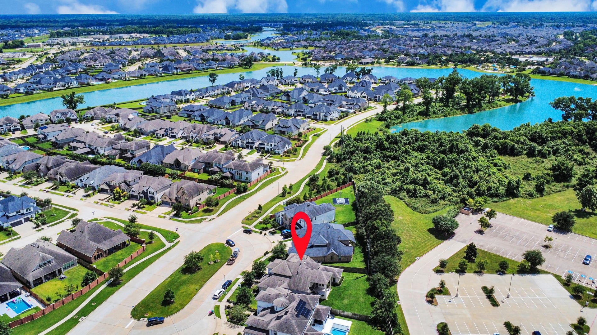 10611 Sawmill Park Drive, Missouri City, TX 77459 Aerial Community View: Located in the desirable Lake Estates section of Sienna with nearby lakes, trails, and community amenities.