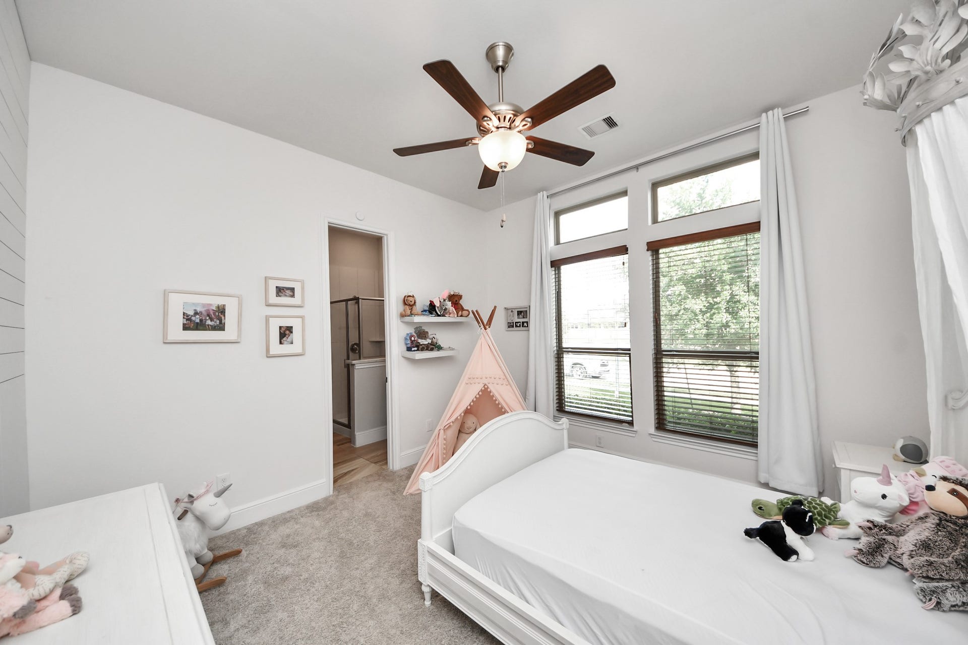 10611 Sawmill Park Drive, Missouri City, TX 77459 Downstairs Bedroom #2: Charming secondary bedroom with custom details and private bath access.