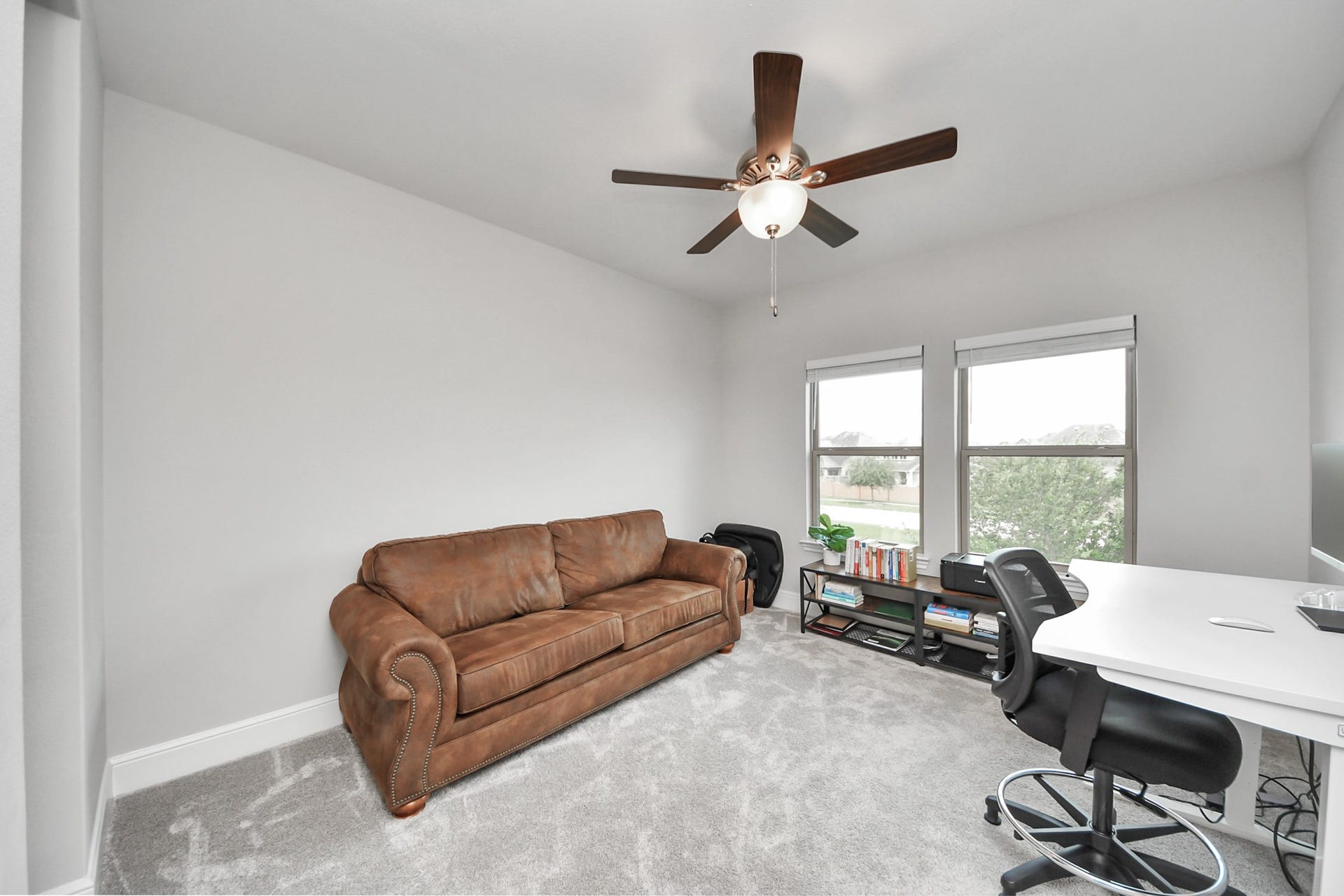 10611 Sawmill Park Drive, Missouri City, TX 77459 Upstairs Bedroom #4: Bright and spacious secondary bedroom designed for comfort and functionality.