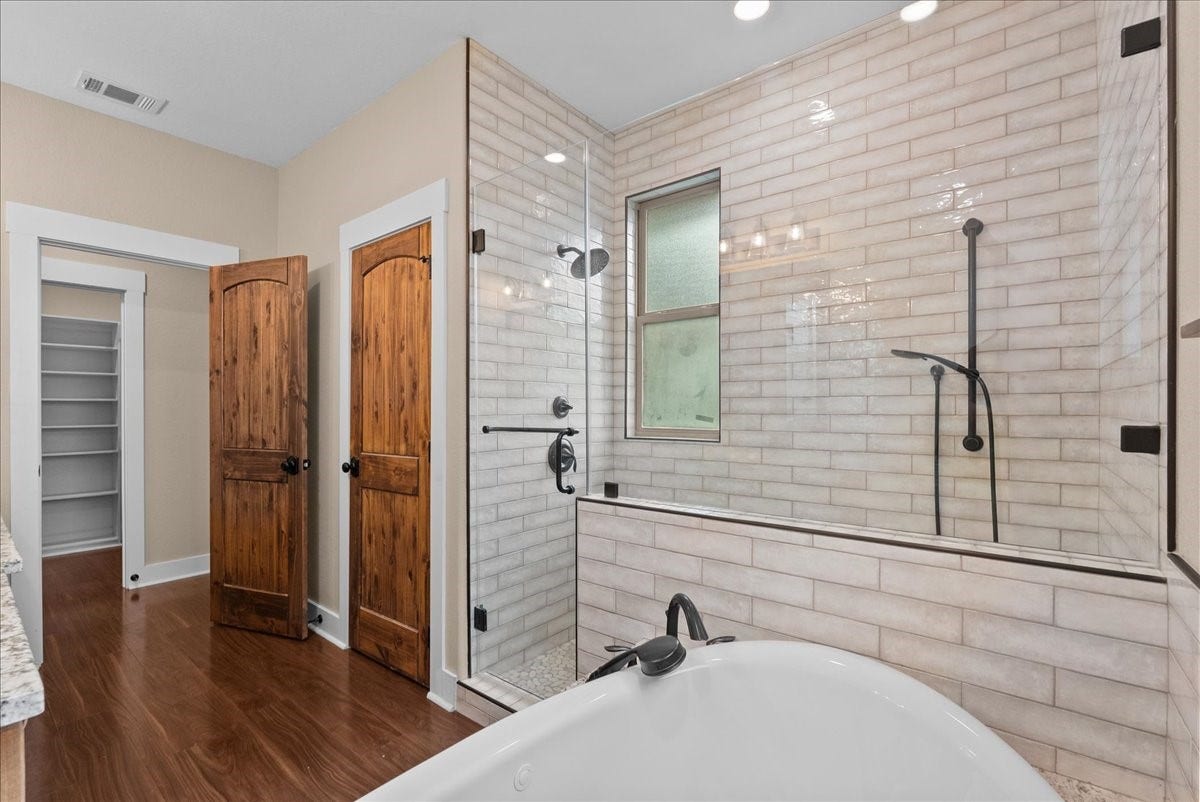 103 Begonia, Lake Jackson, TX 77566 Jetted soaking tub and oversized walk in shower with dual shower heads